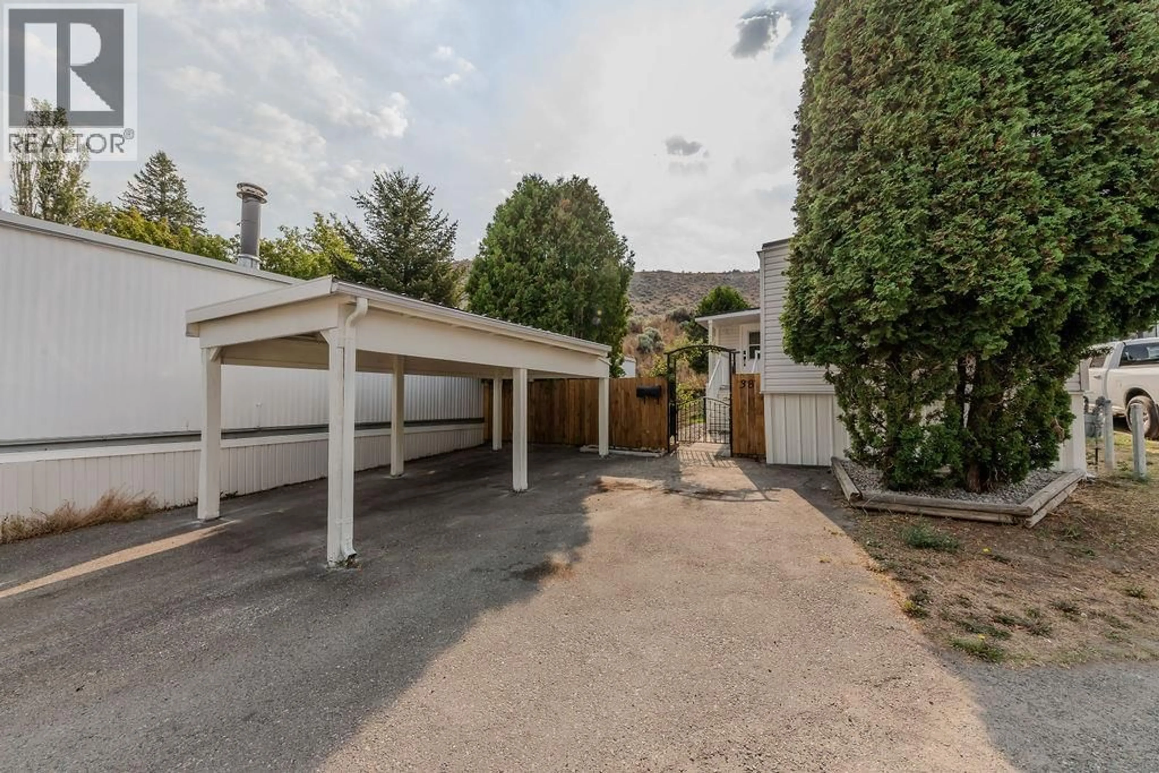 A pic from outside/outdoor area/front of a property/back of a property/a pic from drone, street for 38 - 1175 ROSE HILL ROAD, Kamloops British Columbia V2E1G9