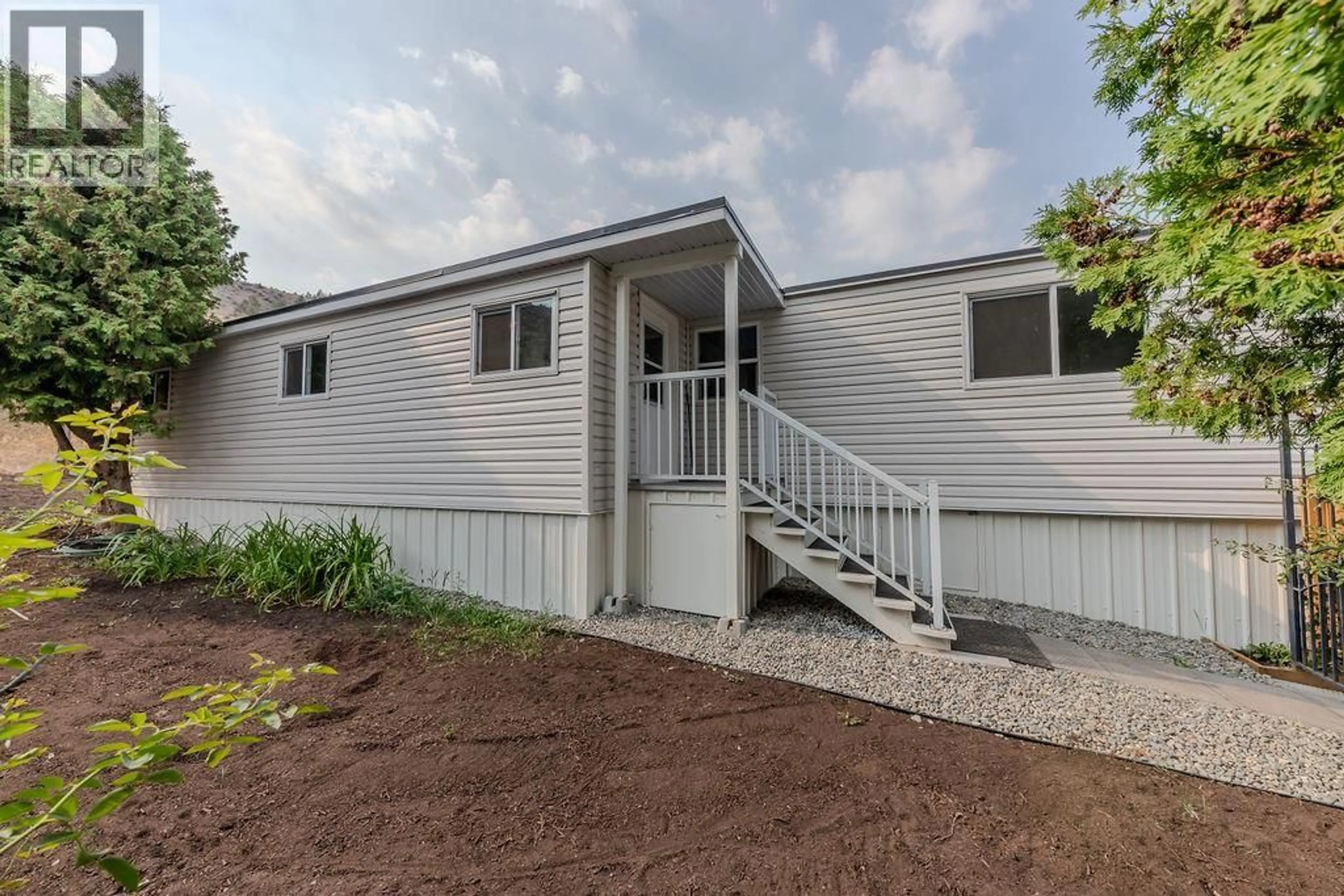 Home with vinyl exterior material, street for 38 - 1175 ROSE HILL ROAD, Kamloops British Columbia V2E1G9