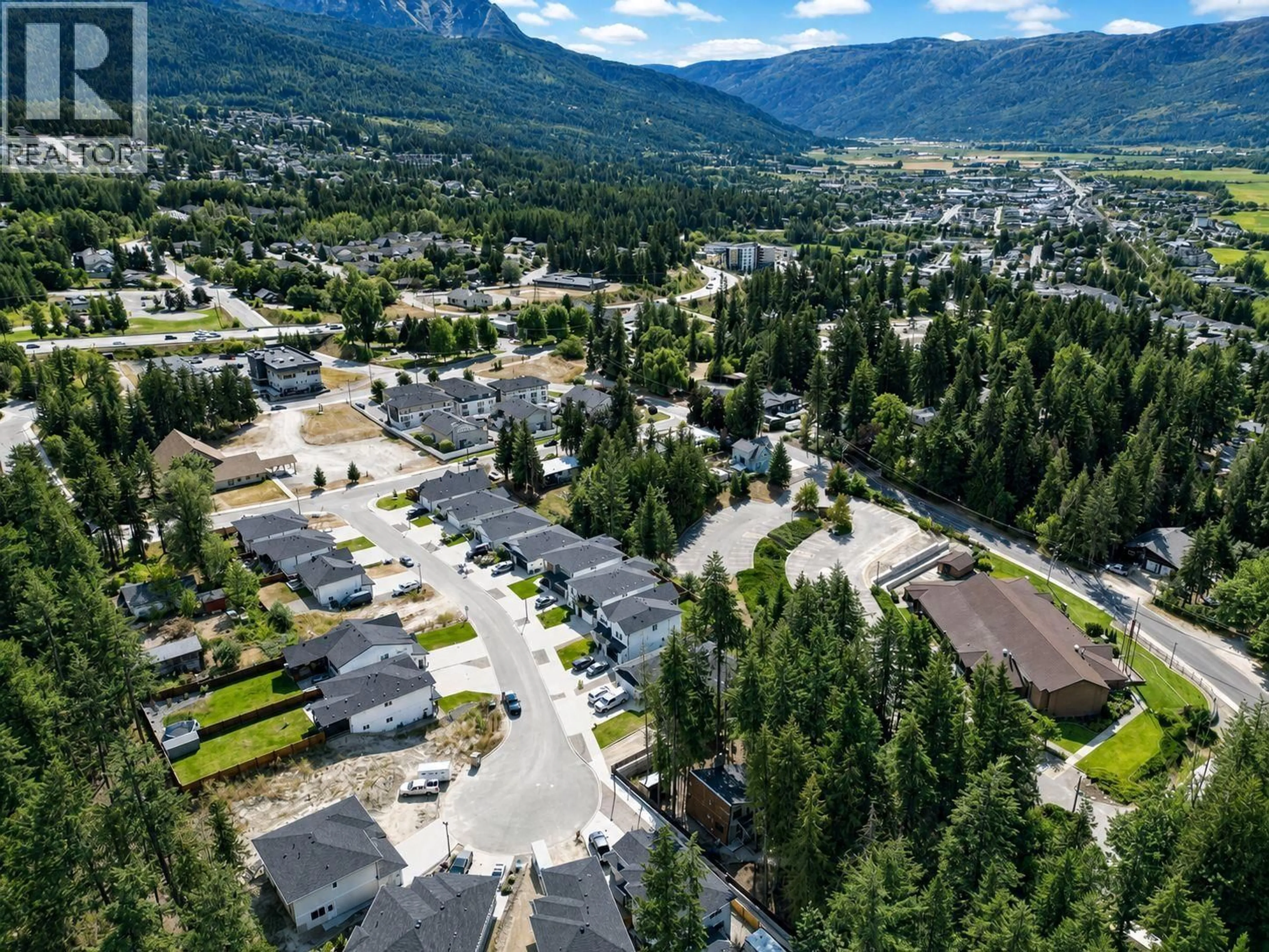 A pic from outside/outdoor area/front of a property/back of a property/a pic from drone, mountain view for 1450 21 STREET NORTHEAST, Salmon Arm British Columbia V1E0G8