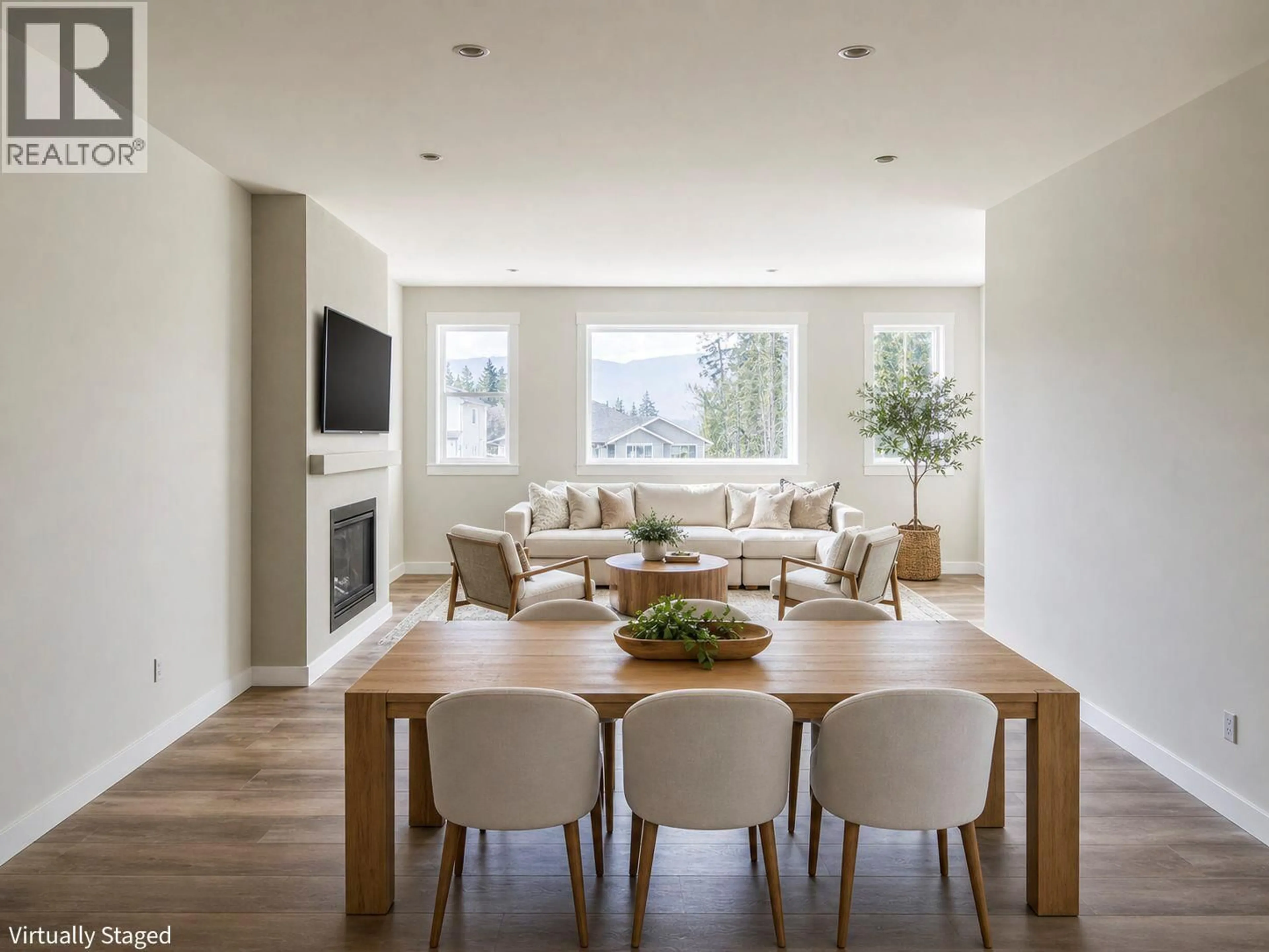Living room with furniture, wood/laminate floor for 1450 21 STREET NORTHEAST, Salmon Arm British Columbia V1E0G8
