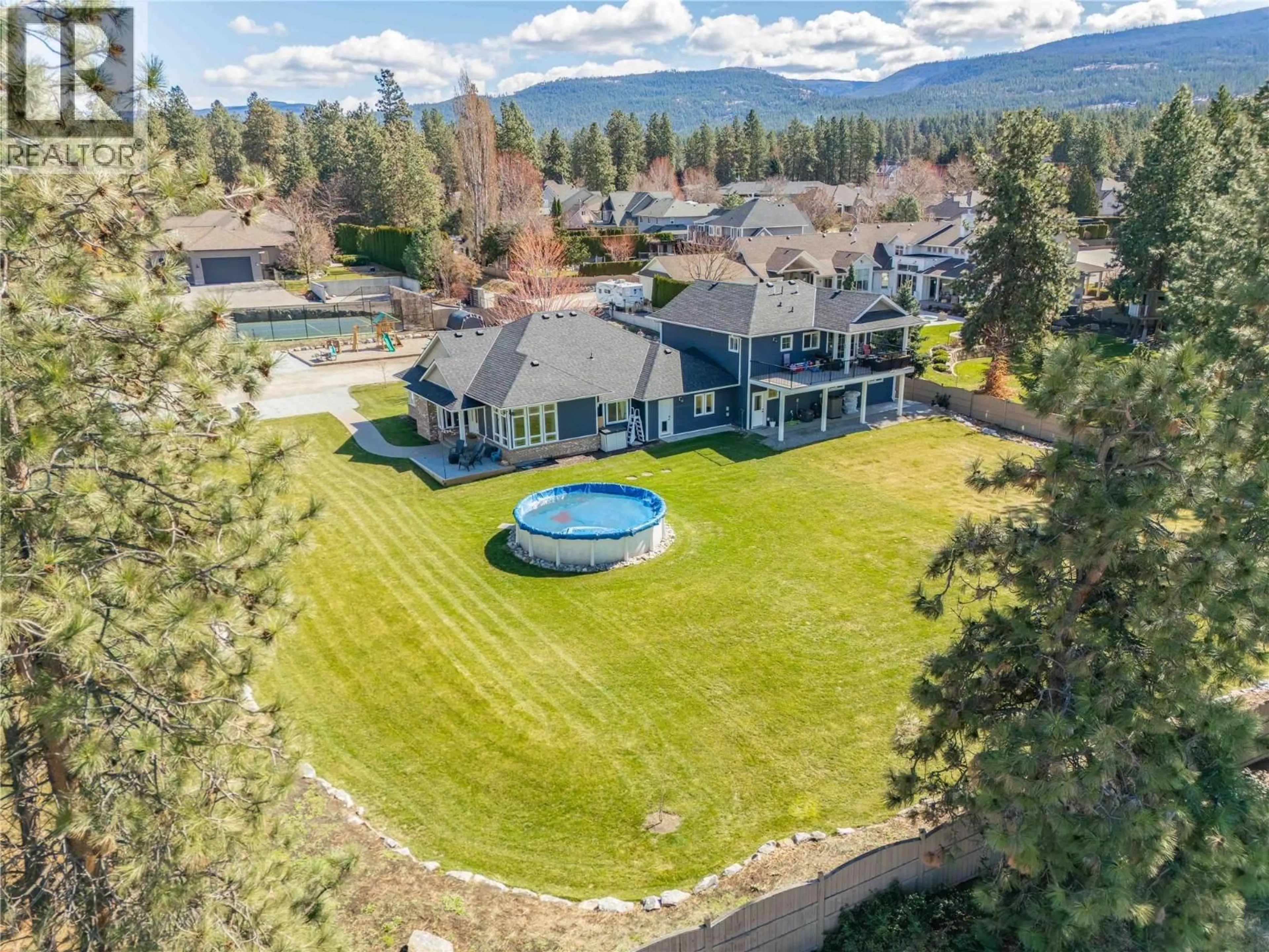 A pic from outside/outdoor area/front of a property/back of a property/a pic from drone, water/lake/river/ocean view for 3350 LARKSPUR COURT, Kelowna British Columbia V1W4E4
