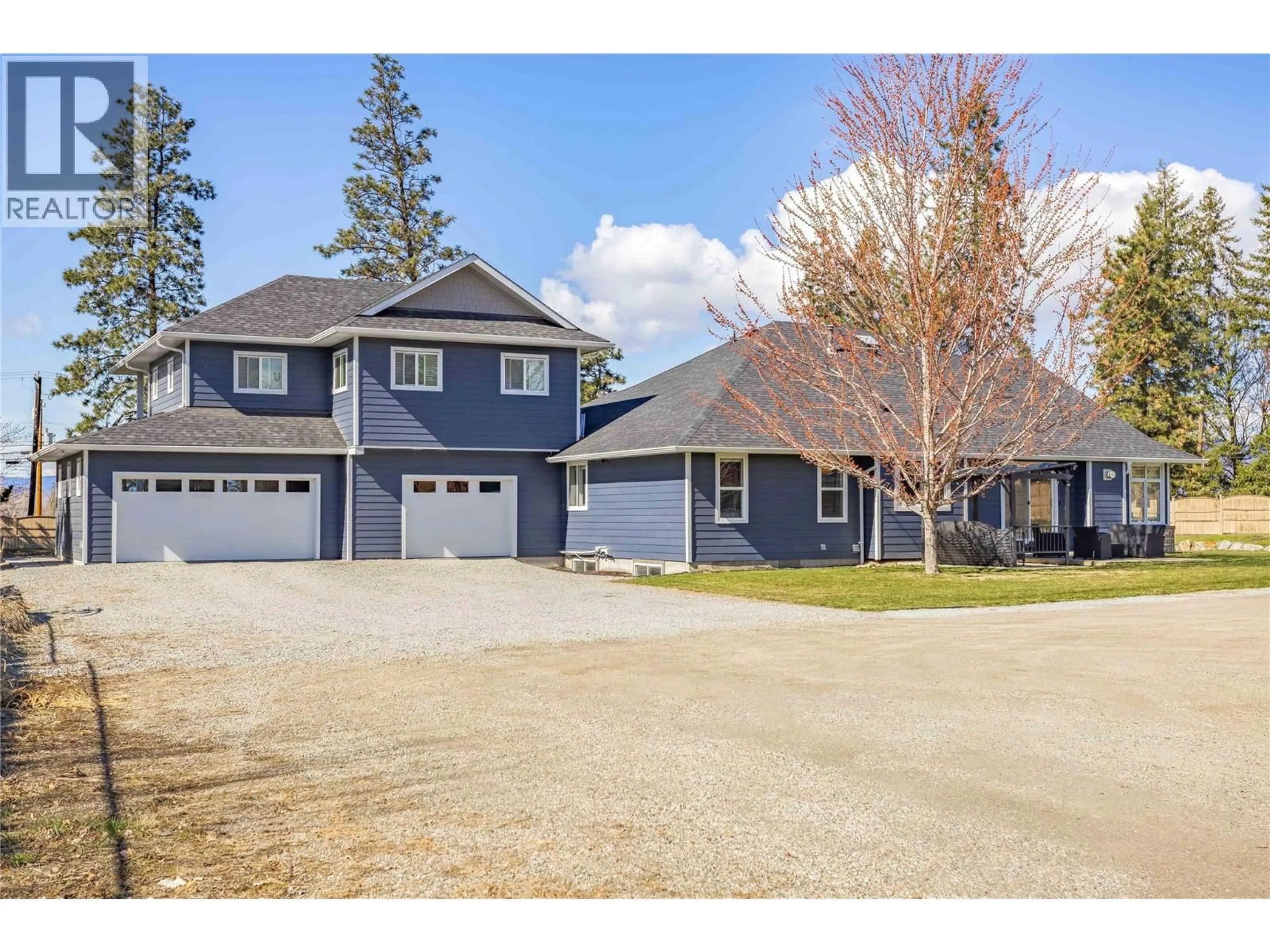 A pic from outside/outdoor area/front of a property/back of a property/a pic from drone, street for 3350 LARKSPUR COURT, Kelowna British Columbia V1W4E4