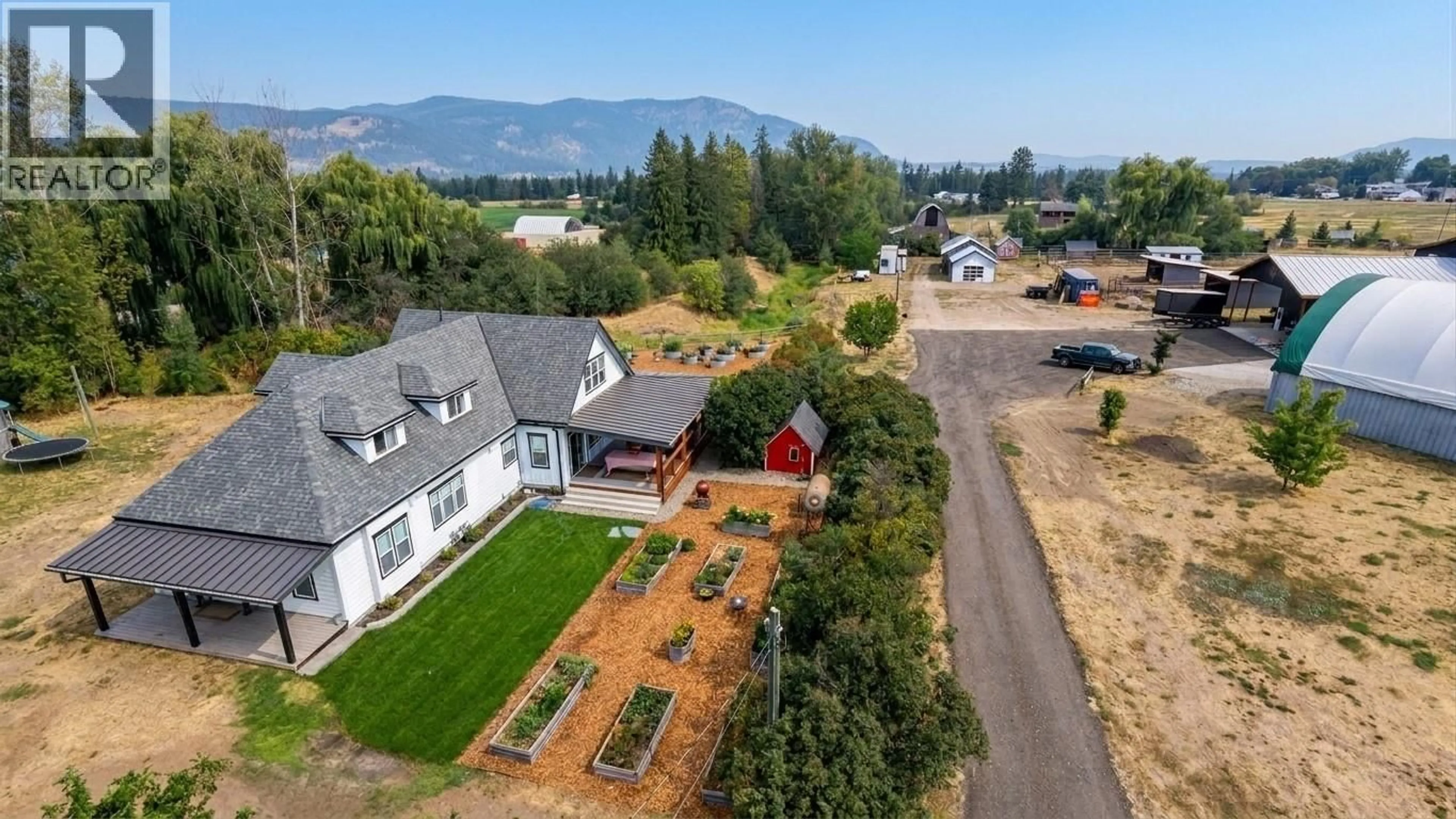 A pic from outside/outdoor area/front of a property/back of a property/a pic from drone, mountain view for 1130 THOMAS HAYES ROAD, Spallumcheen British Columbia V0E1B6