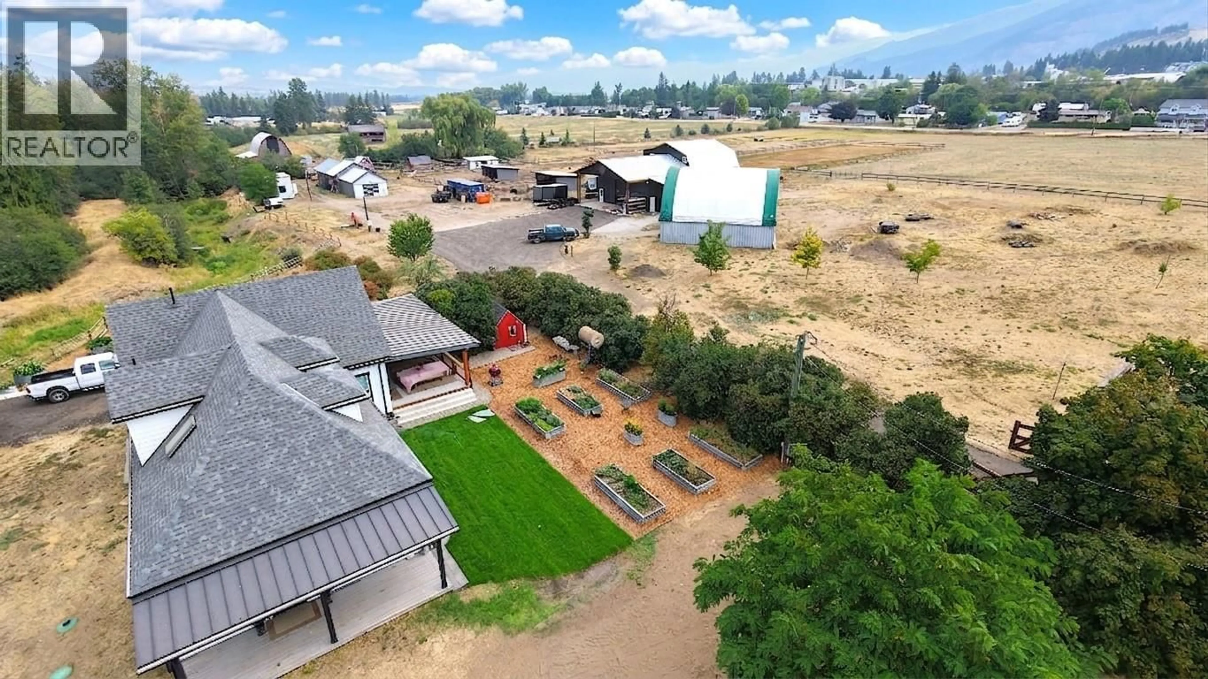 A pic from outside/outdoor area/front of a property/back of a property/a pic from drone, mountain view for 1130 THOMAS HAYES ROAD, Spallumcheen British Columbia V0E1B6