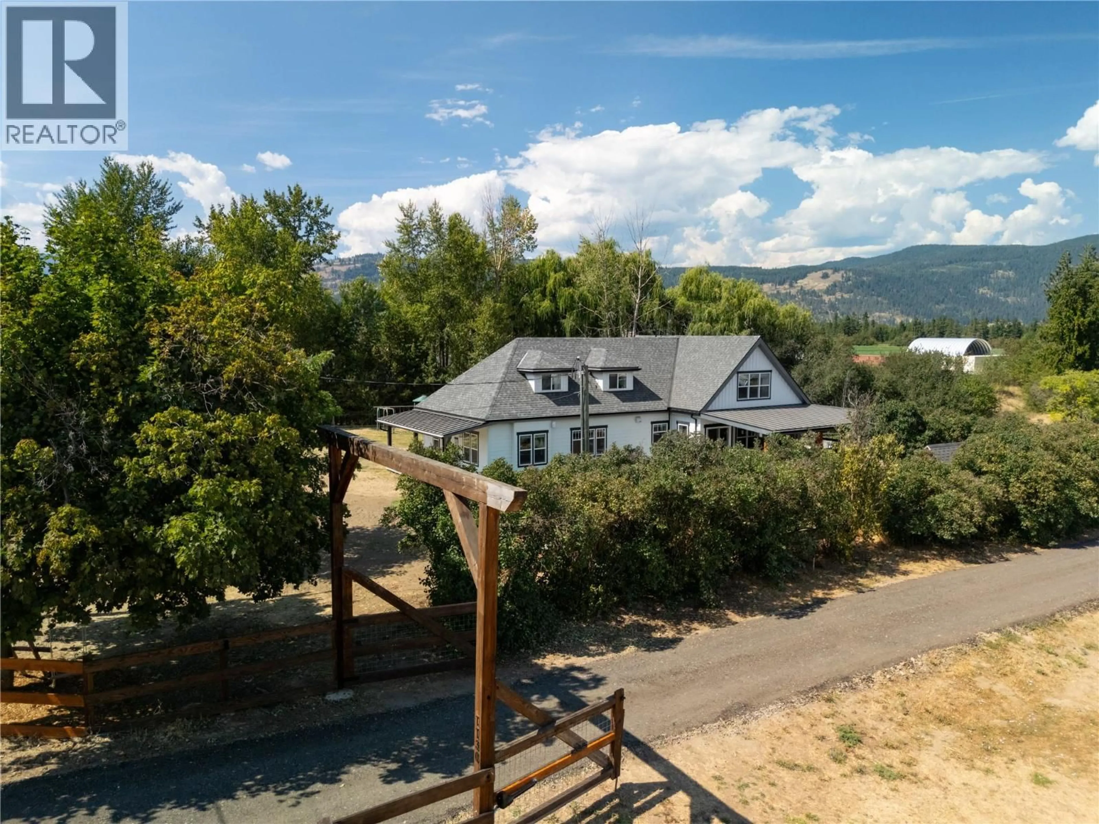 A pic from outside/outdoor area/front of a property/back of a property/a pic from drone, mountain view for 1130 THOMAS HAYES ROAD, Spallumcheen British Columbia V0E1B6