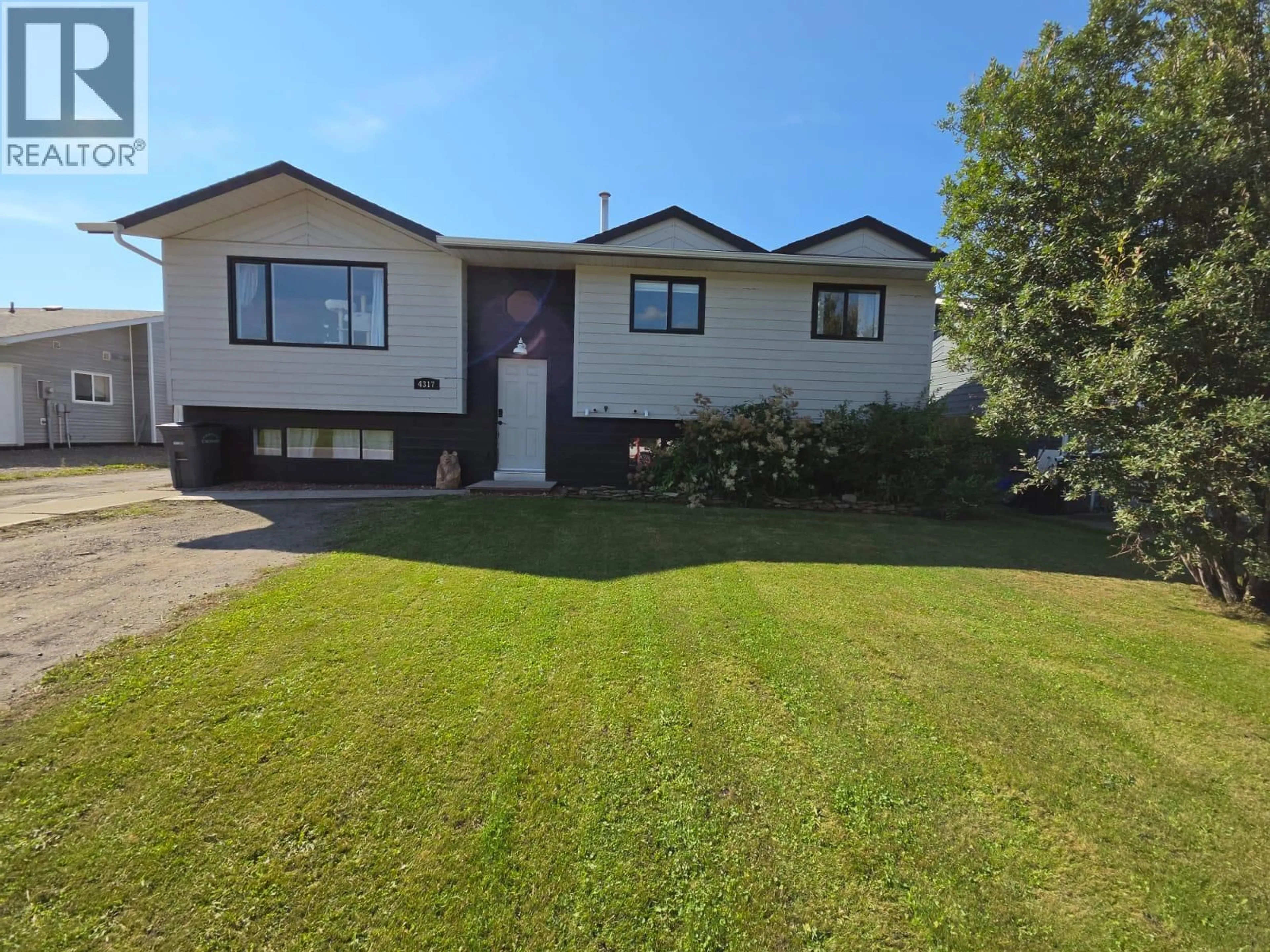 A pic from outside/outdoor area/front of a property/back of a property/a pic from drone, street for 4317 51A AVENUE NORTHEAST, Chetwynd British Columbia V0C1J0