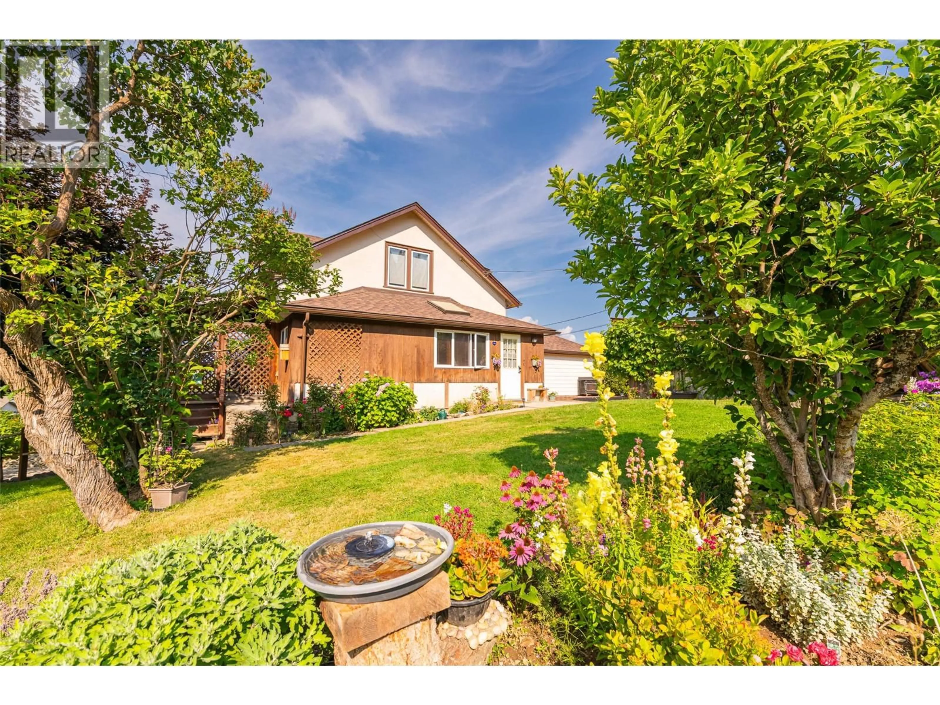 A pic from outside/outdoor area/front of a property/back of a property/a pic from drone, street for 1843 MCLAREN STREET, Creston British Columbia V0B1G5