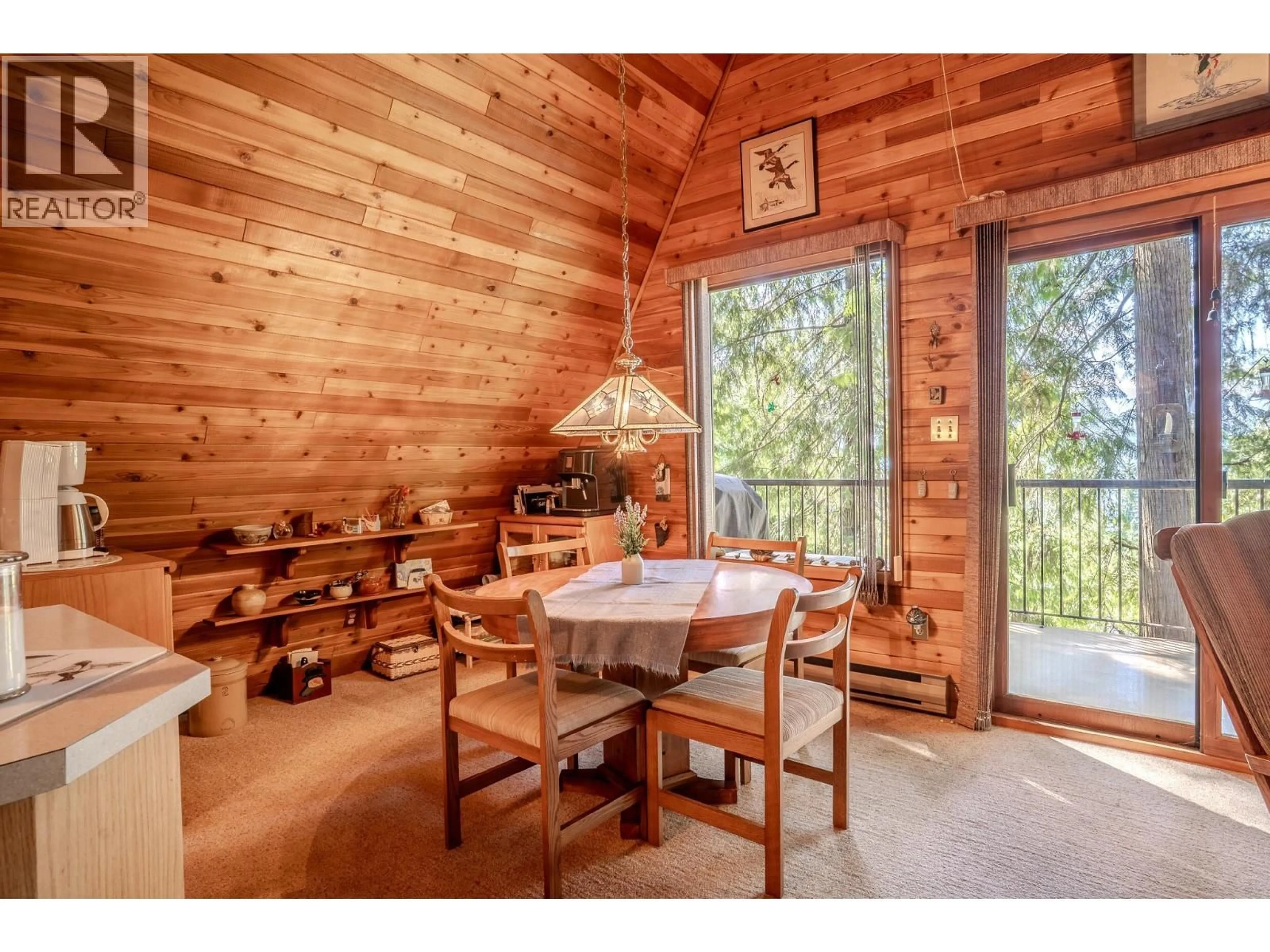 Dining room, wood/laminate floor for 7496 CASTLE HEIGHTS, Anglemont British Columbia V0E1M8