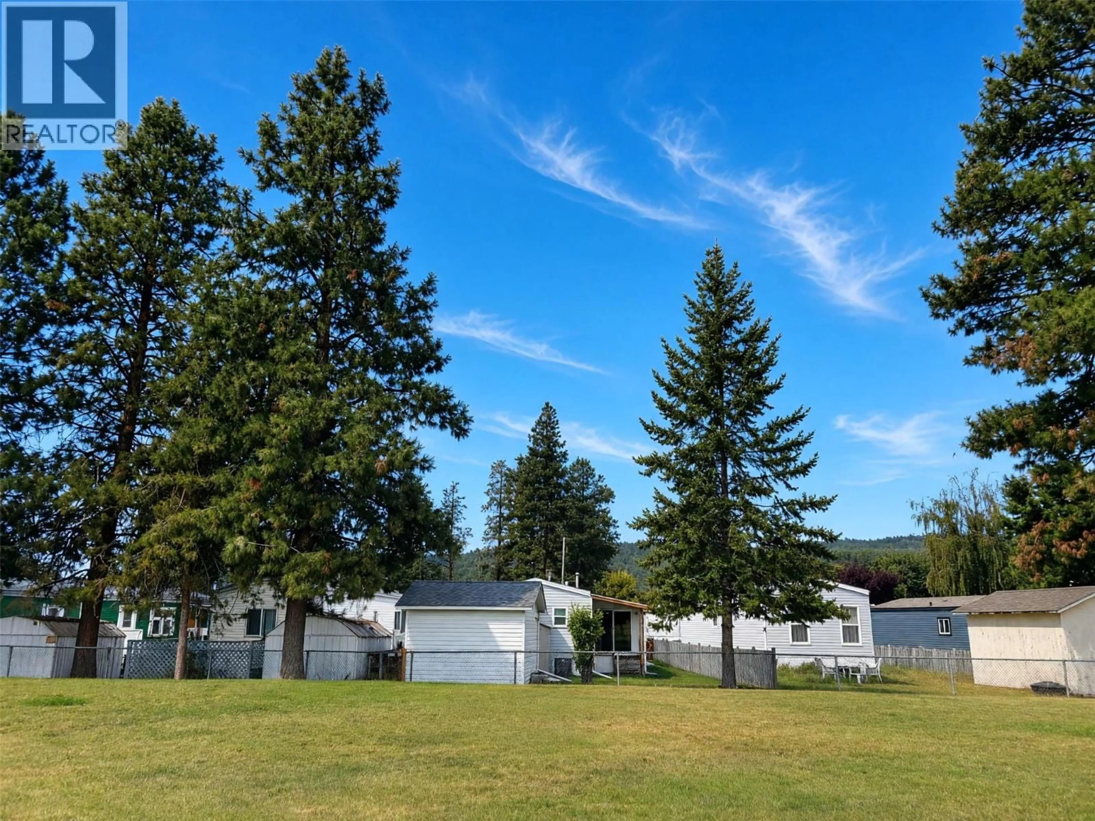 A pic from outside/outdoor area/front of a property/back of a property/a pic from drone, mountain view for 61 - 724 INNES AVENUE, Cranbrook British Columbia V1C2A5