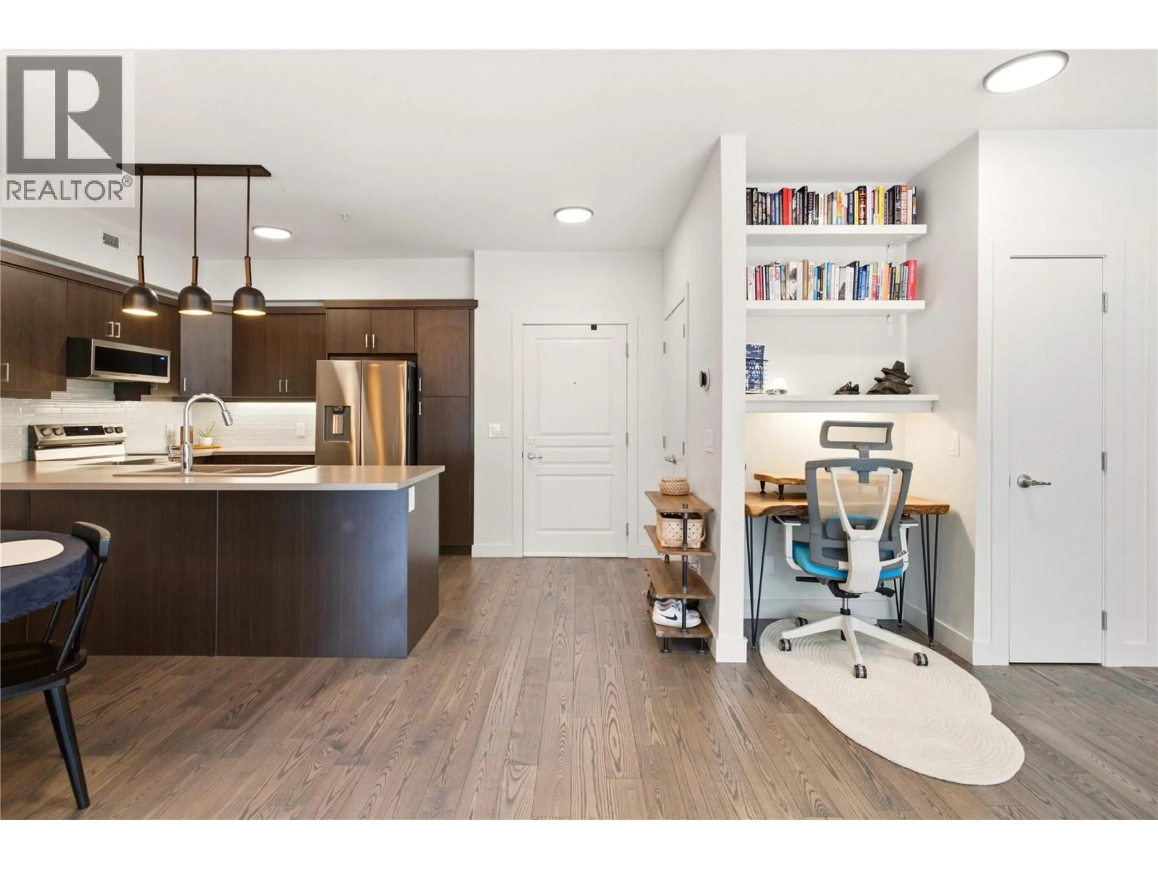 Open concept kitchen, wood/laminate floor for 205 - 660 LEQUIME ROAD, Kelowna British Columbia V1W1A4