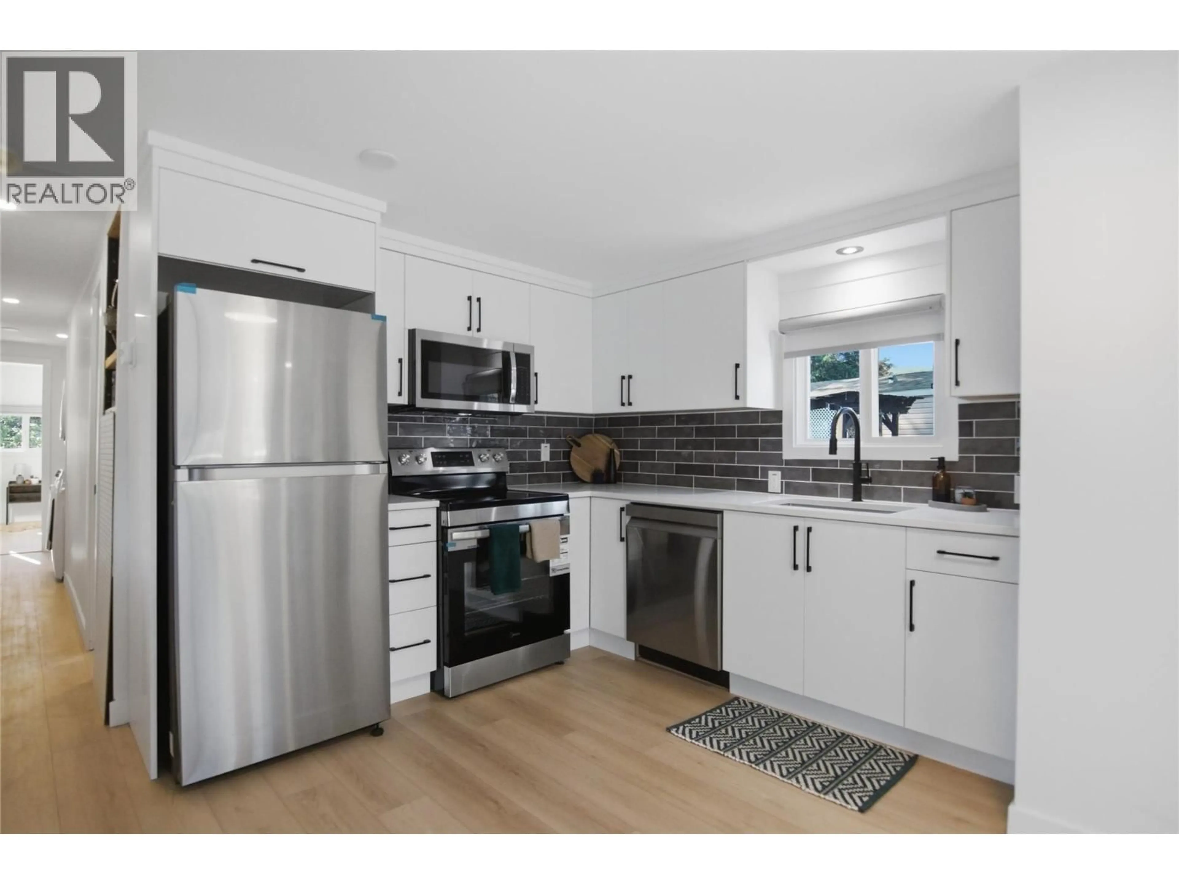 Open concept kitchen, wood/laminate floor for 11 - 4564 SUMMER ROAD, Barriere British Columbia V0E1E0
