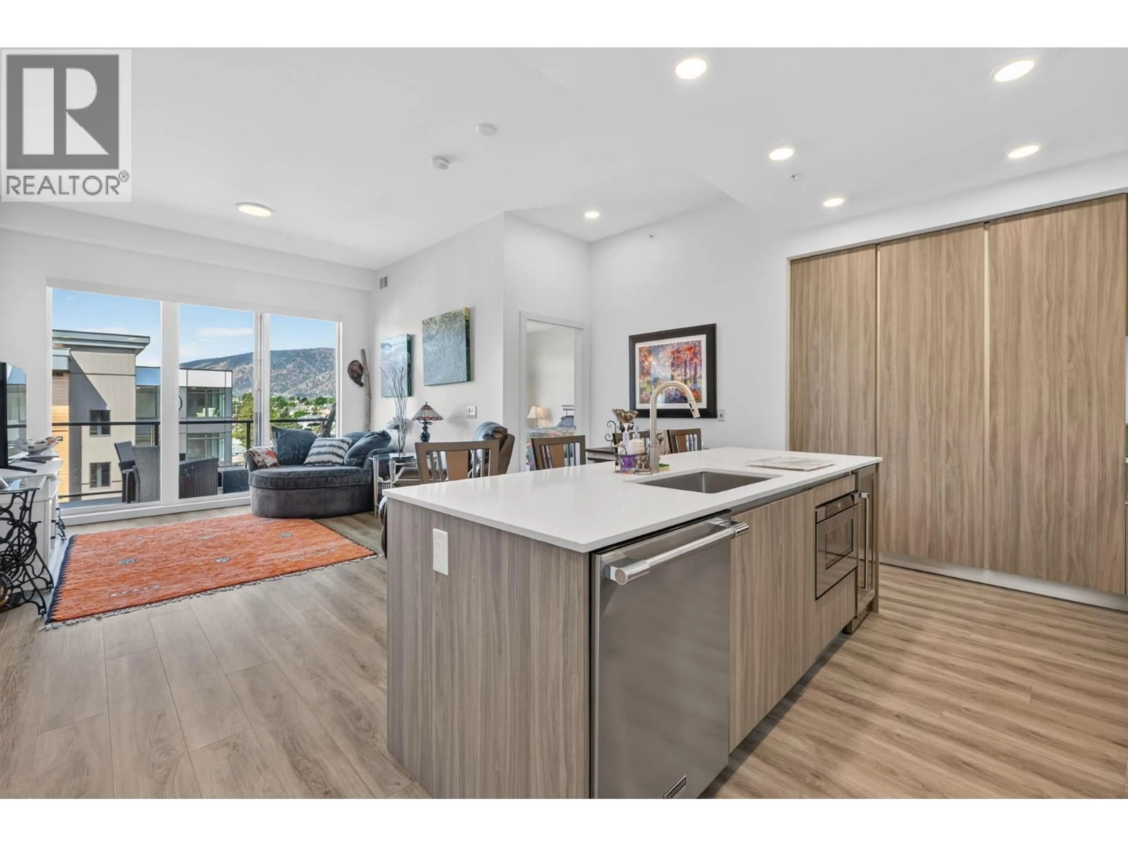 Open concept kitchen, wood/laminate floor for 601 - 2780 OLALLA ROAD, West Kelowna British Columbia V1Z2A9