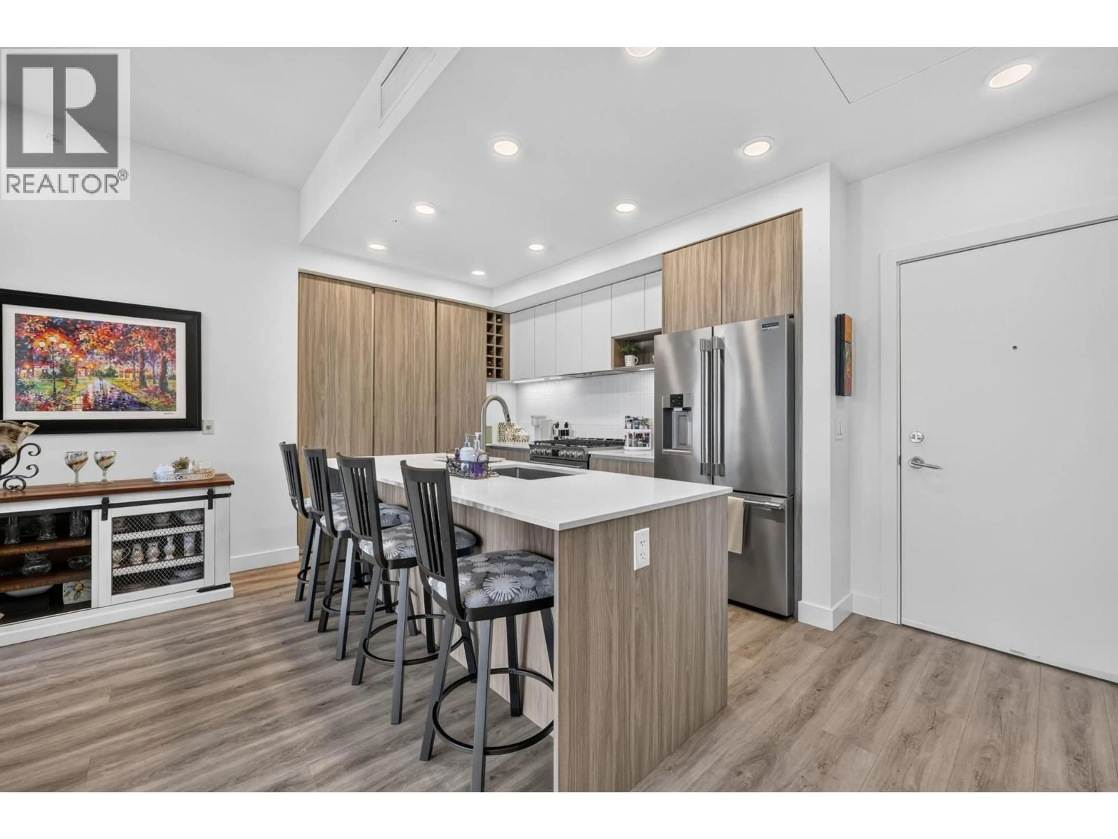 Open concept kitchen, wood/laminate floor for 601 - 2780 OLALLA ROAD, West Kelowna British Columbia V1Z2A9