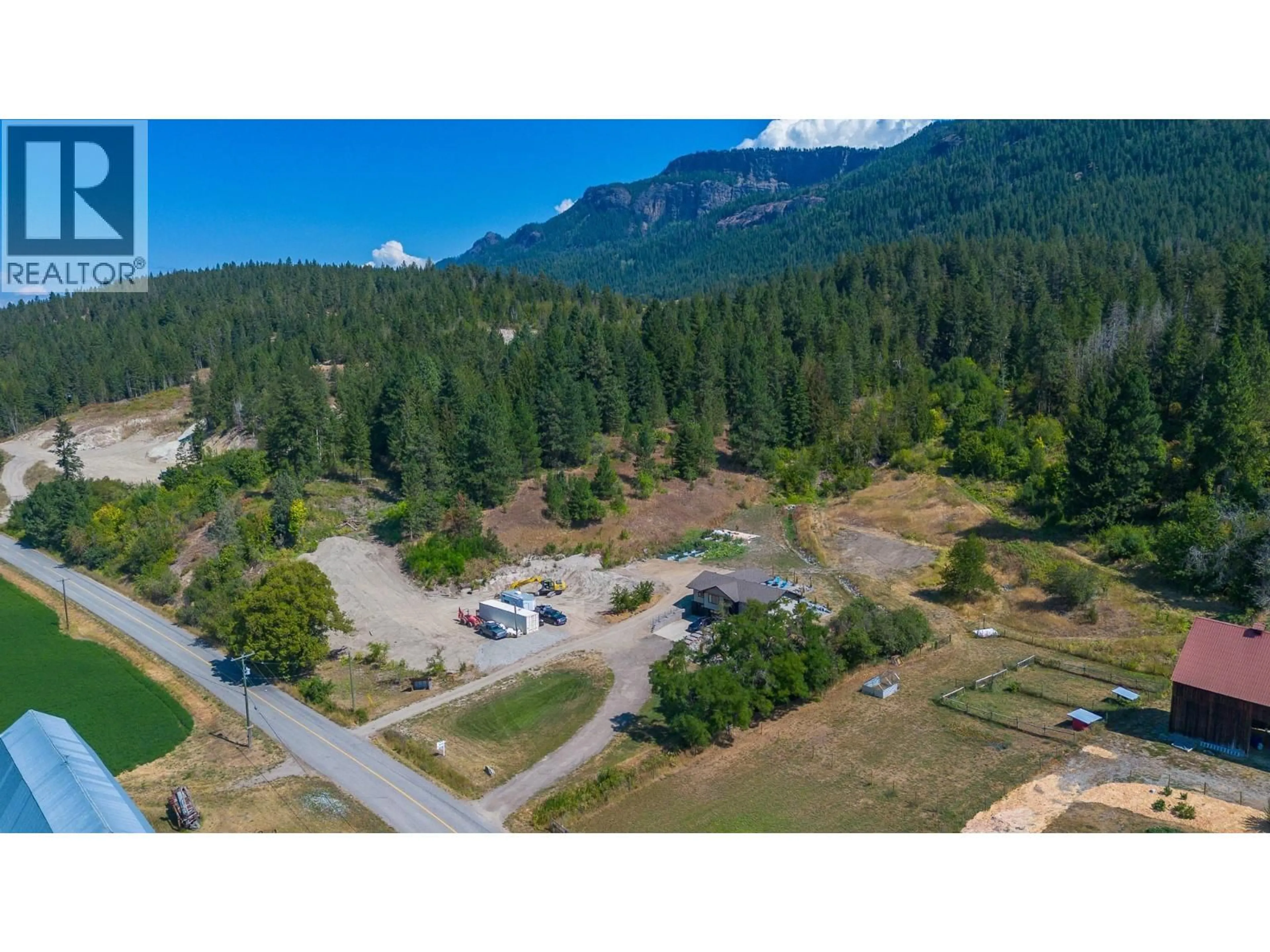 A pic from outside/outdoor area/front of a property/back of a property/a pic from drone, mountain view for 211 ENDERBY GRINDROD ROAD, Enderby British Columbia V0E1V4