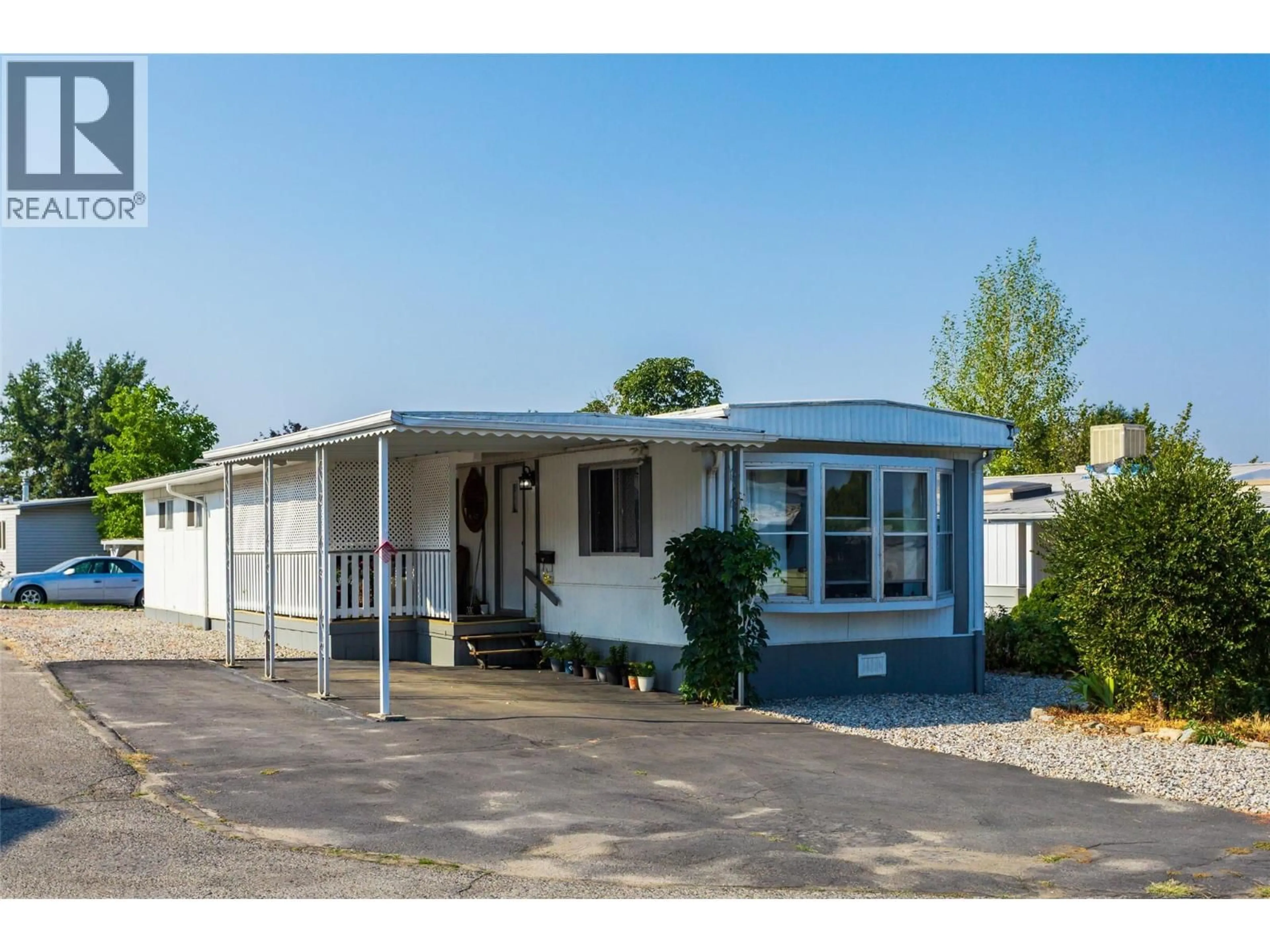 Home with vinyl exterior material, street for 217 - 3591 OLD VERNON ROAD, Kelowna British Columbia V1X6P4