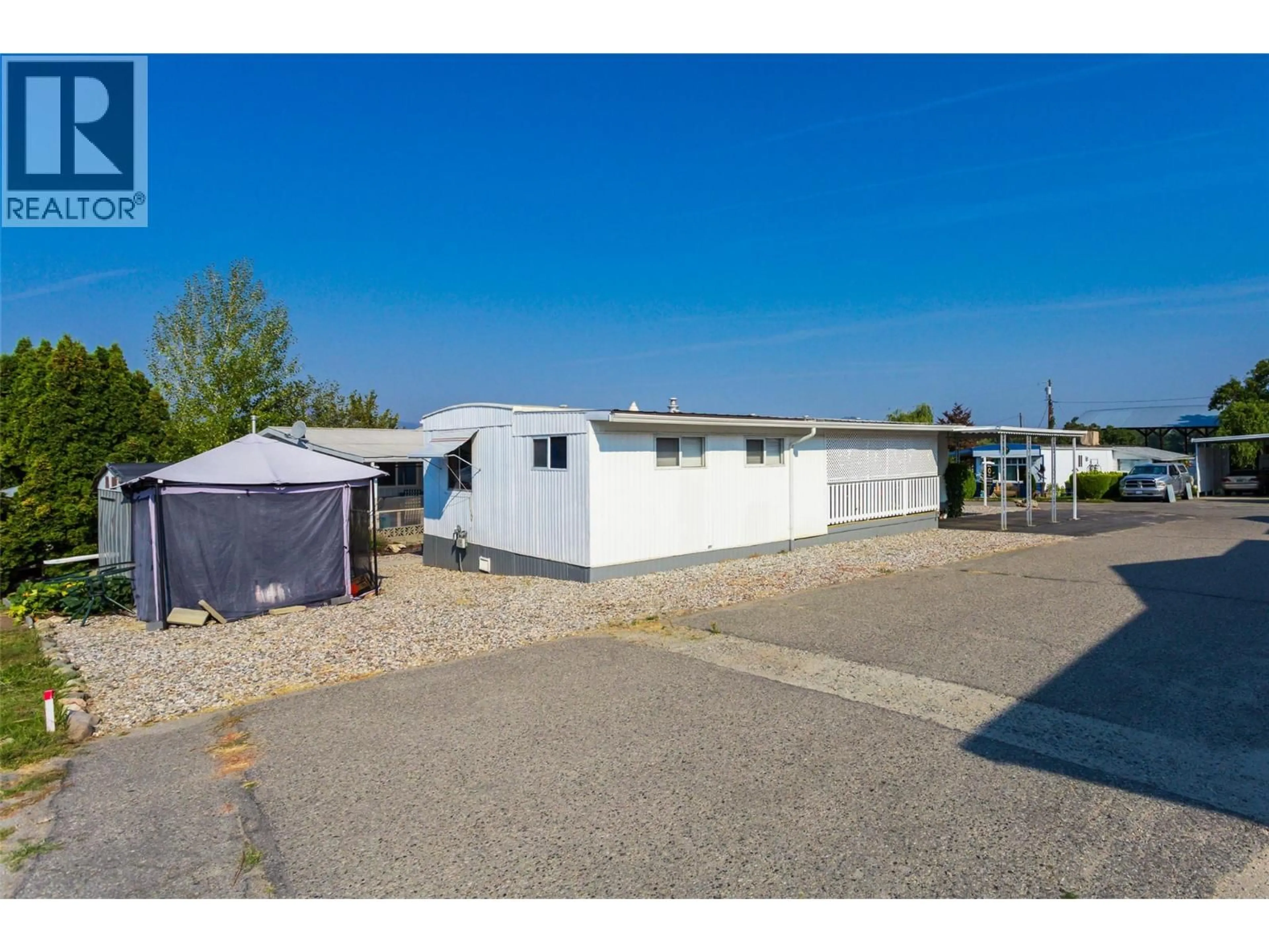 A pic from outside/outdoor area/front of a property/back of a property/a pic from drone, street for 217 - 3591 OLD VERNON ROAD, Kelowna British Columbia V1X6P4