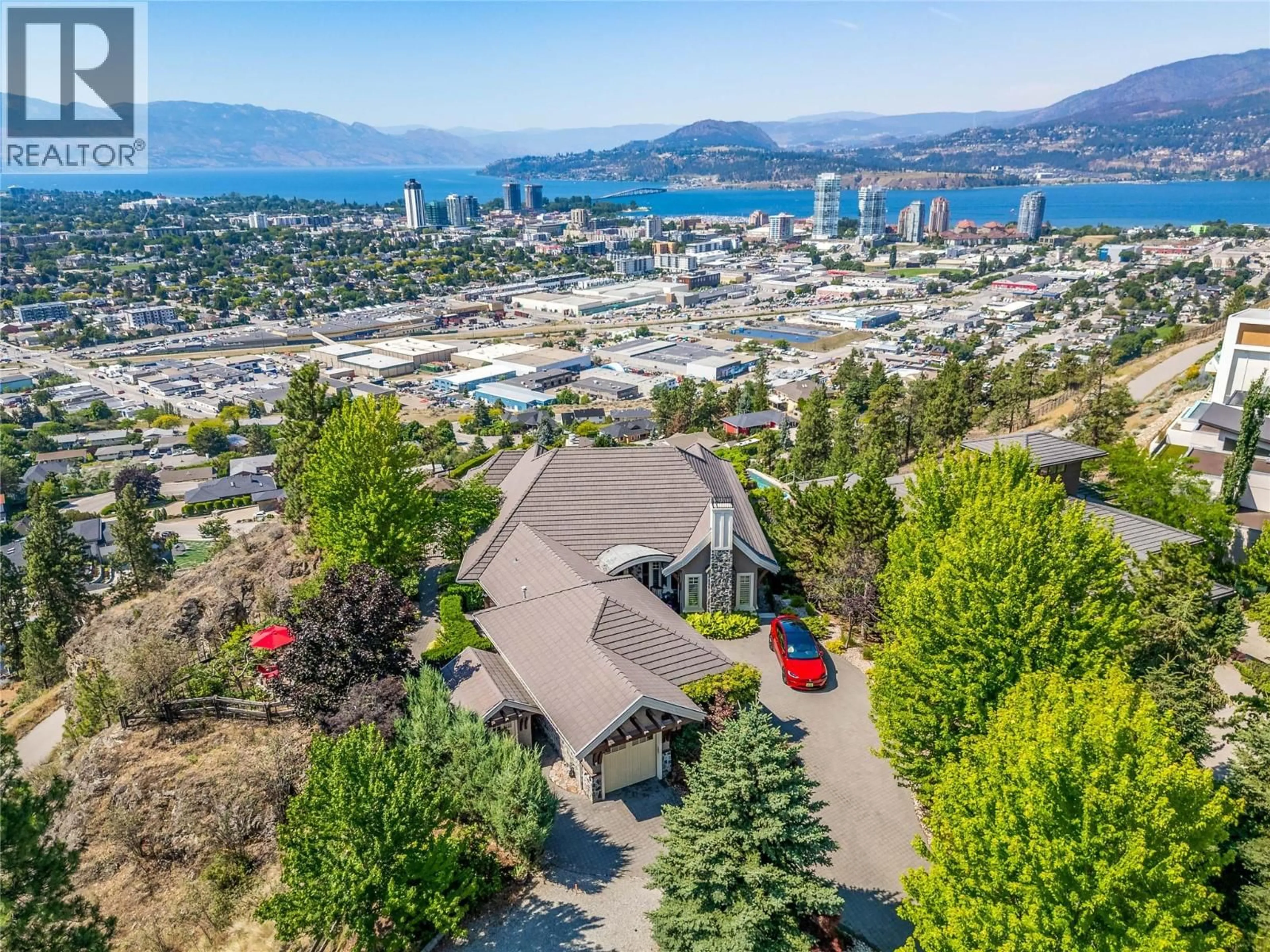 A pic from outside/outdoor area/front of a property/back of a property/a pic from drone, mountain view for 1173 PARKBLUFF LANE, Kelowna British Columbia V1V2Y3