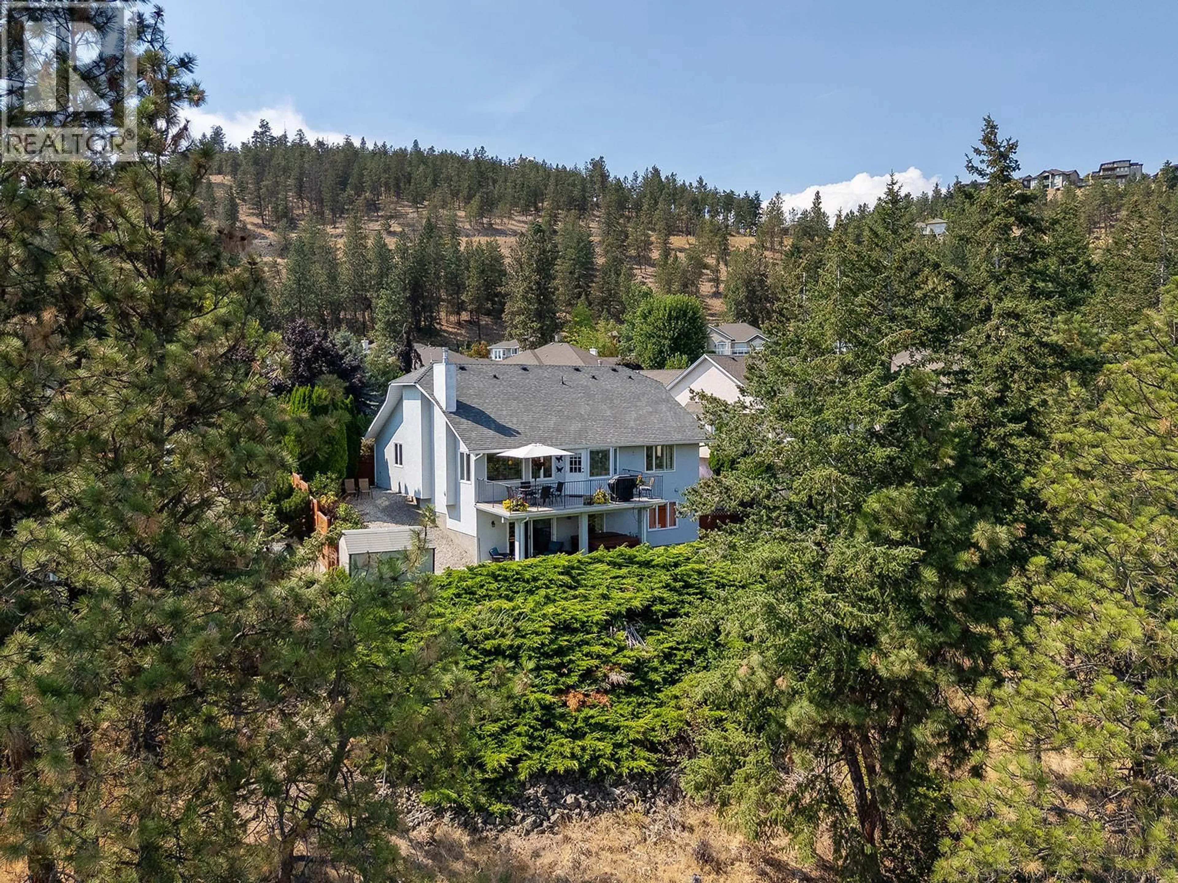 A pic from outside/outdoor area/front of a property/back of a property/a pic from drone, forest/trees view for 735 NAHANNI PLACE, Kelowna British Columbia V1V1N5