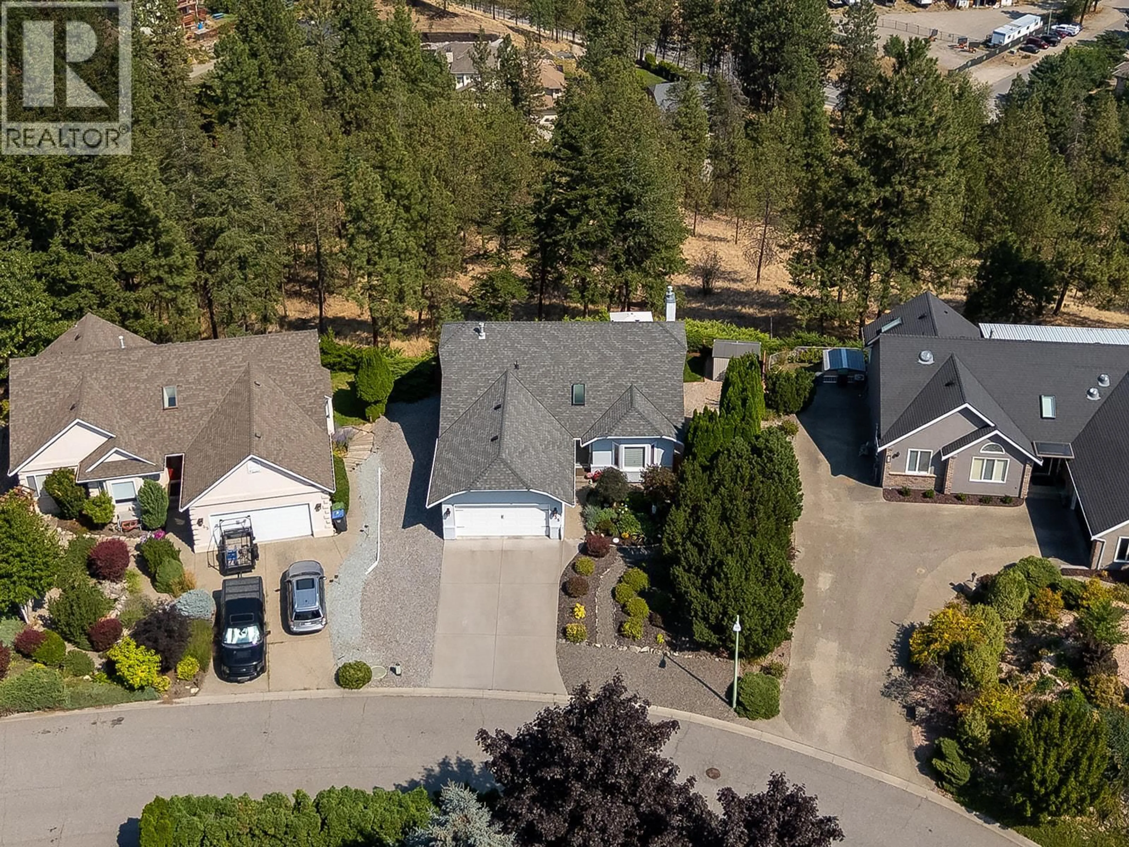 A pic from outside/outdoor area/front of a property/back of a property/a pic from drone, mountain view for 735 NAHANNI PLACE, Kelowna British Columbia V1V1N5