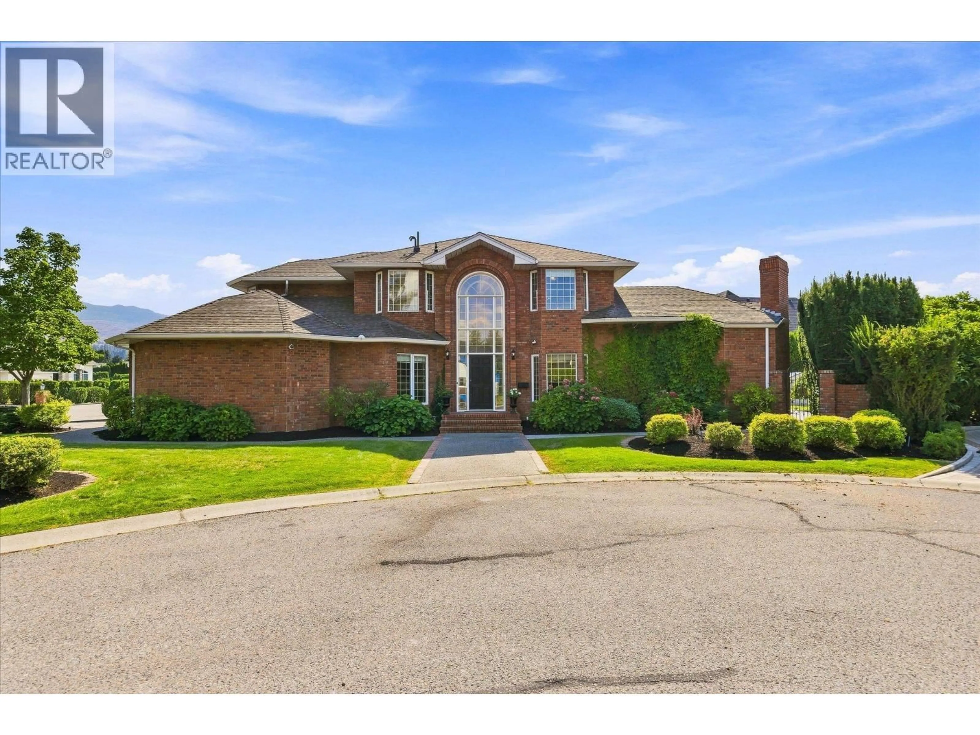 Home with brick exterior material, street for 5 - 4524 ELDORADO COURT, Kelowna British Columbia V1W1G3