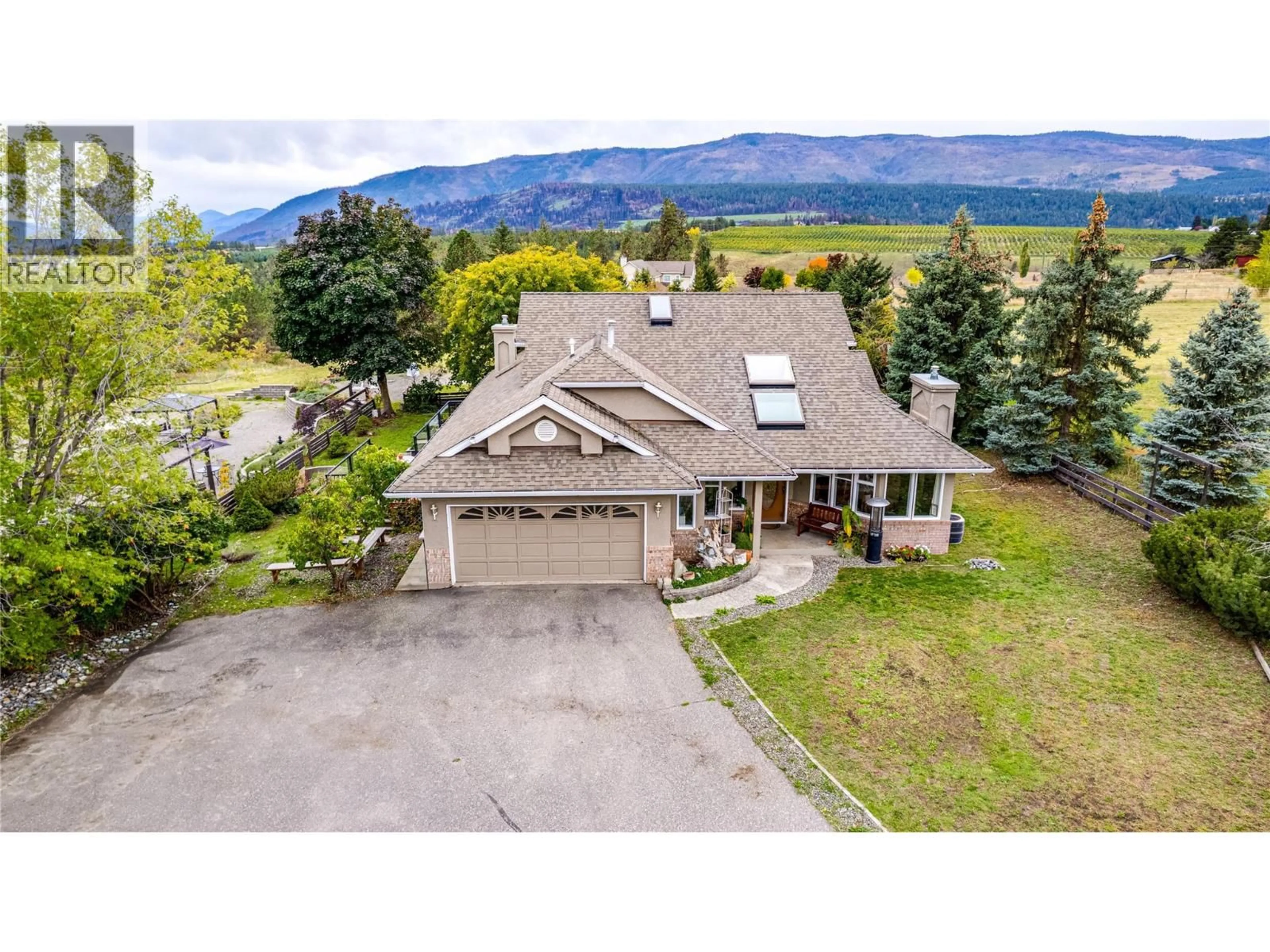 A pic from outside/outdoor area/front of a property/back of a property/a pic from drone, mountain view for 4671 GRANDVIEW FLATS ROAD SOUTH, Spallumcheen British Columbia V4Y0P6