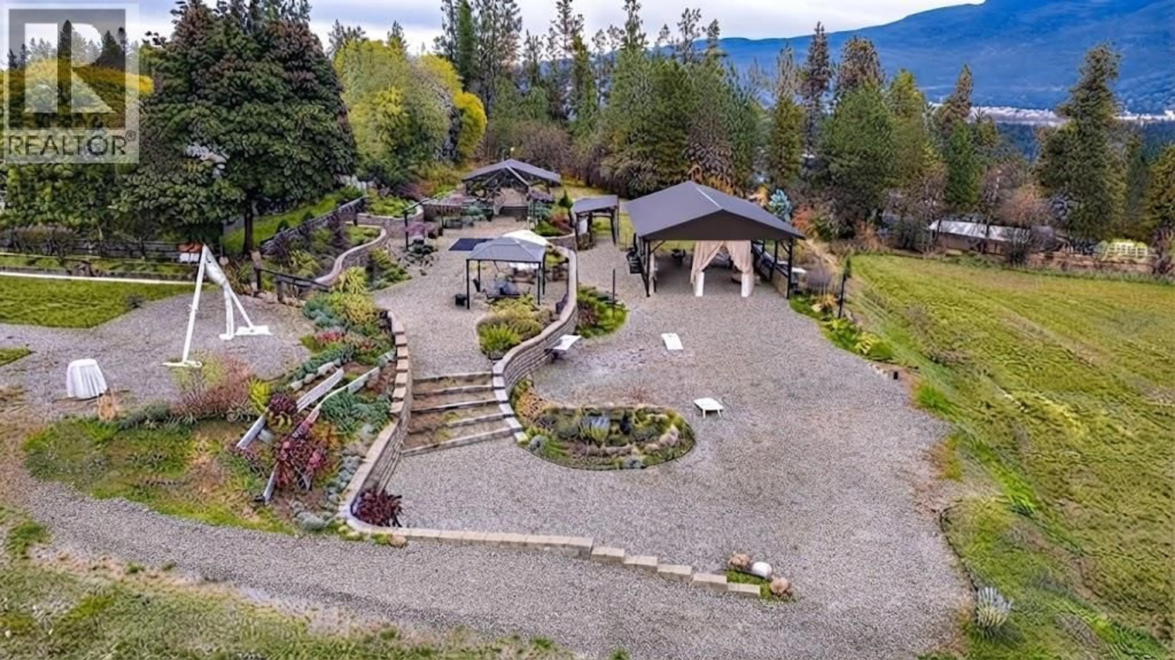 A pic from outside/outdoor area/front of a property/back of a property/a pic from drone, mountain view for 4671 GRANDVIEW FLATS ROAD SOUTH, Spallumcheen British Columbia V4Y0P6