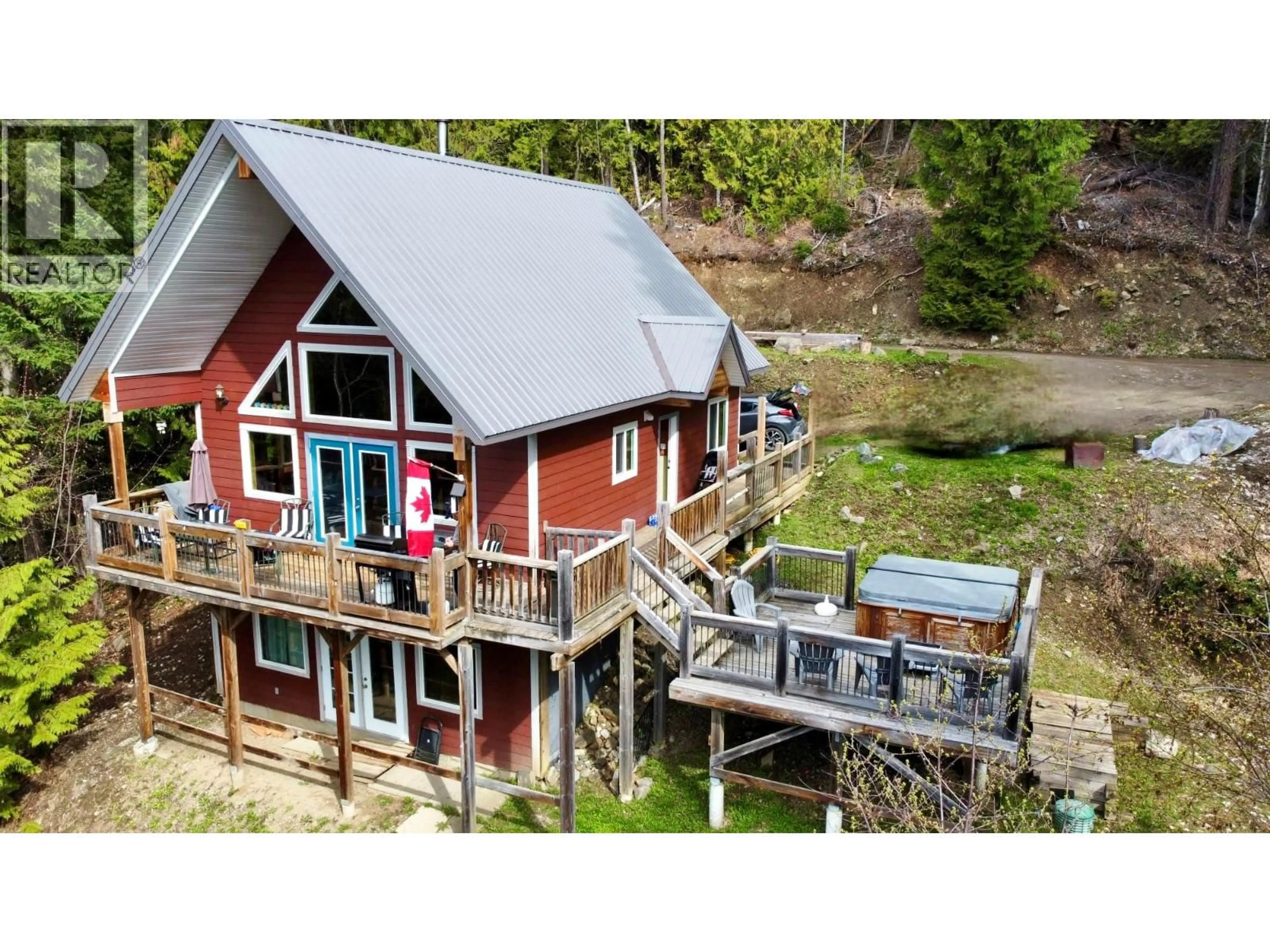 A pic from outside/outdoor area/front of a property/back of a property/a pic from drone, water/lake/river/ocean view for 3000 VICKERS TRAIL, Anglemont British Columbia V0E1M8