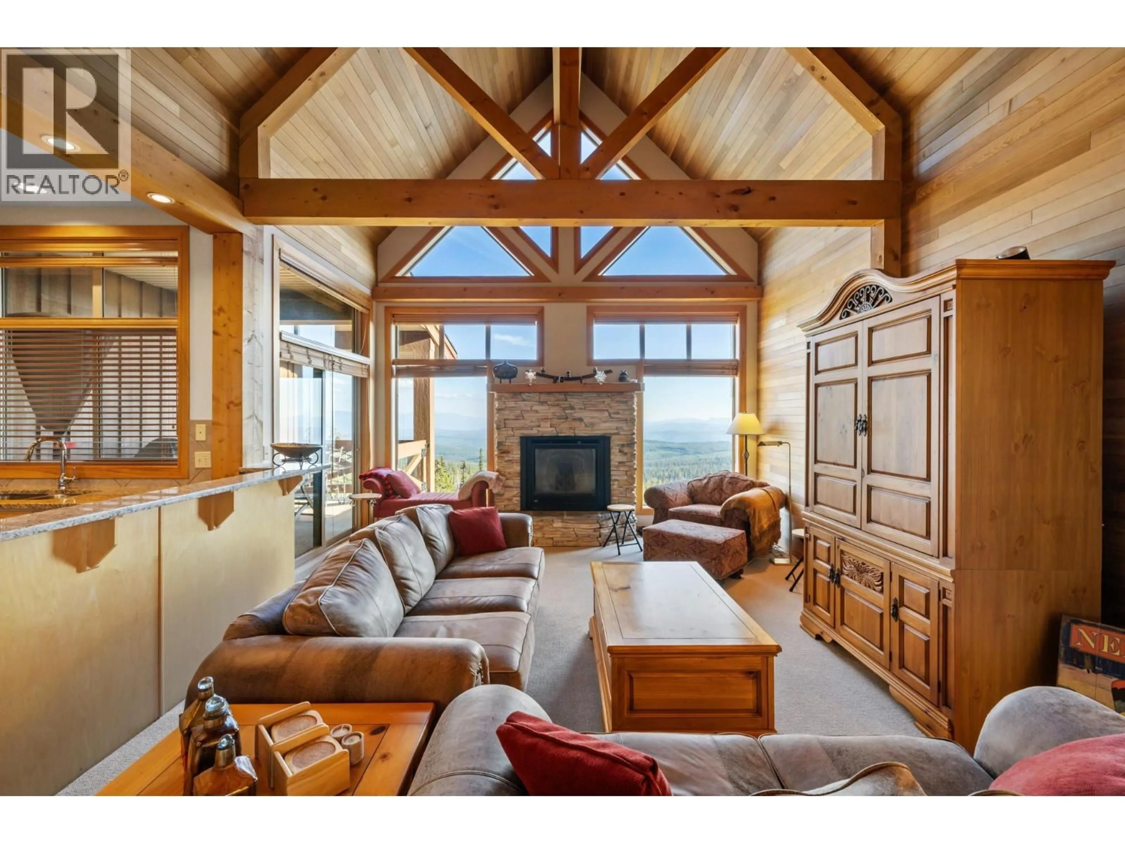 Living room with furniture, wood/laminate floor for 11 - 165 KETTLE VIEW ROAD, Big White British Columbia V1P1P3
