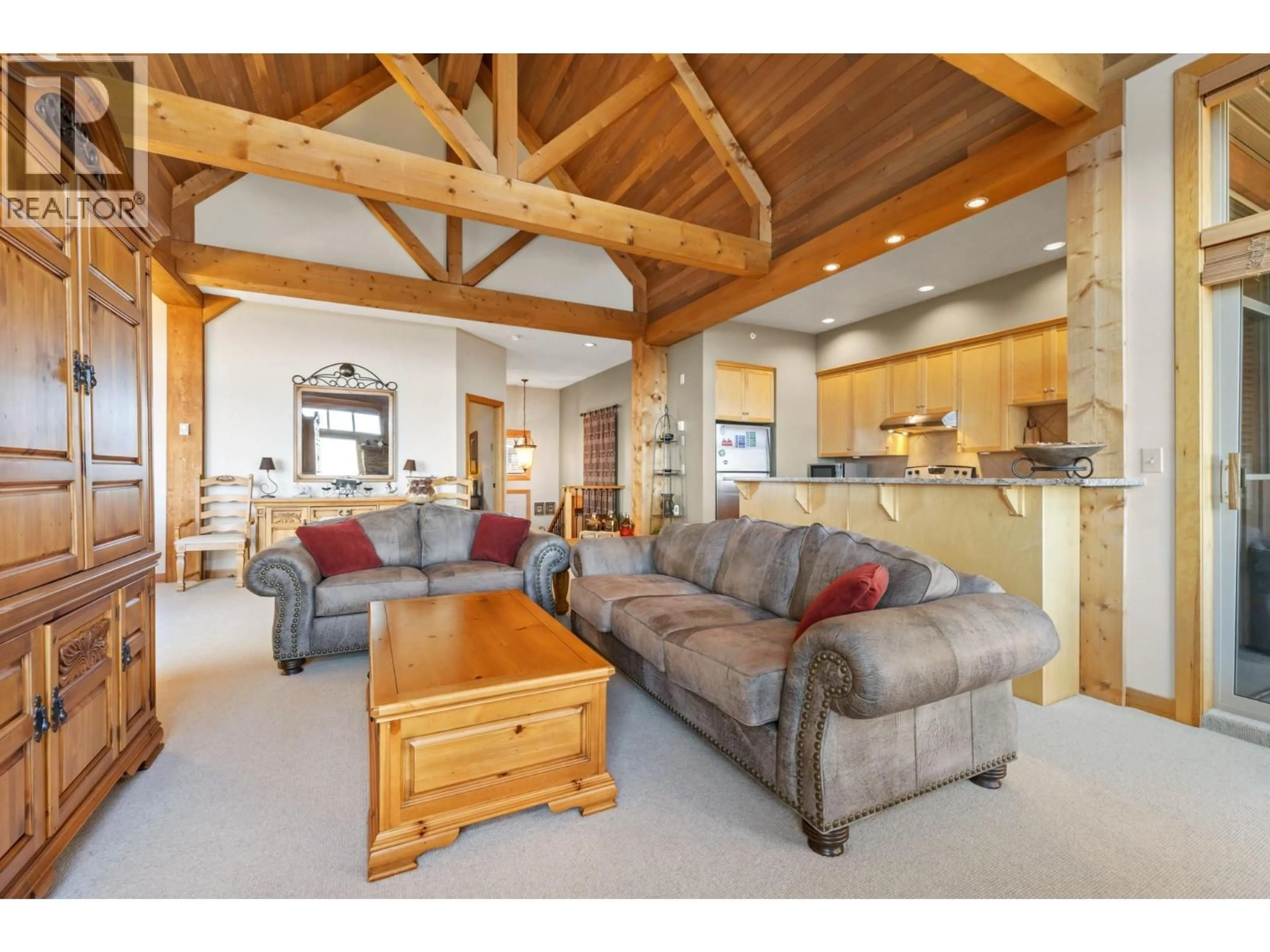 Living room with furniture, wood/laminate floor for 11 - 165 KETTLE VIEW ROAD, Big White British Columbia V1P1P3