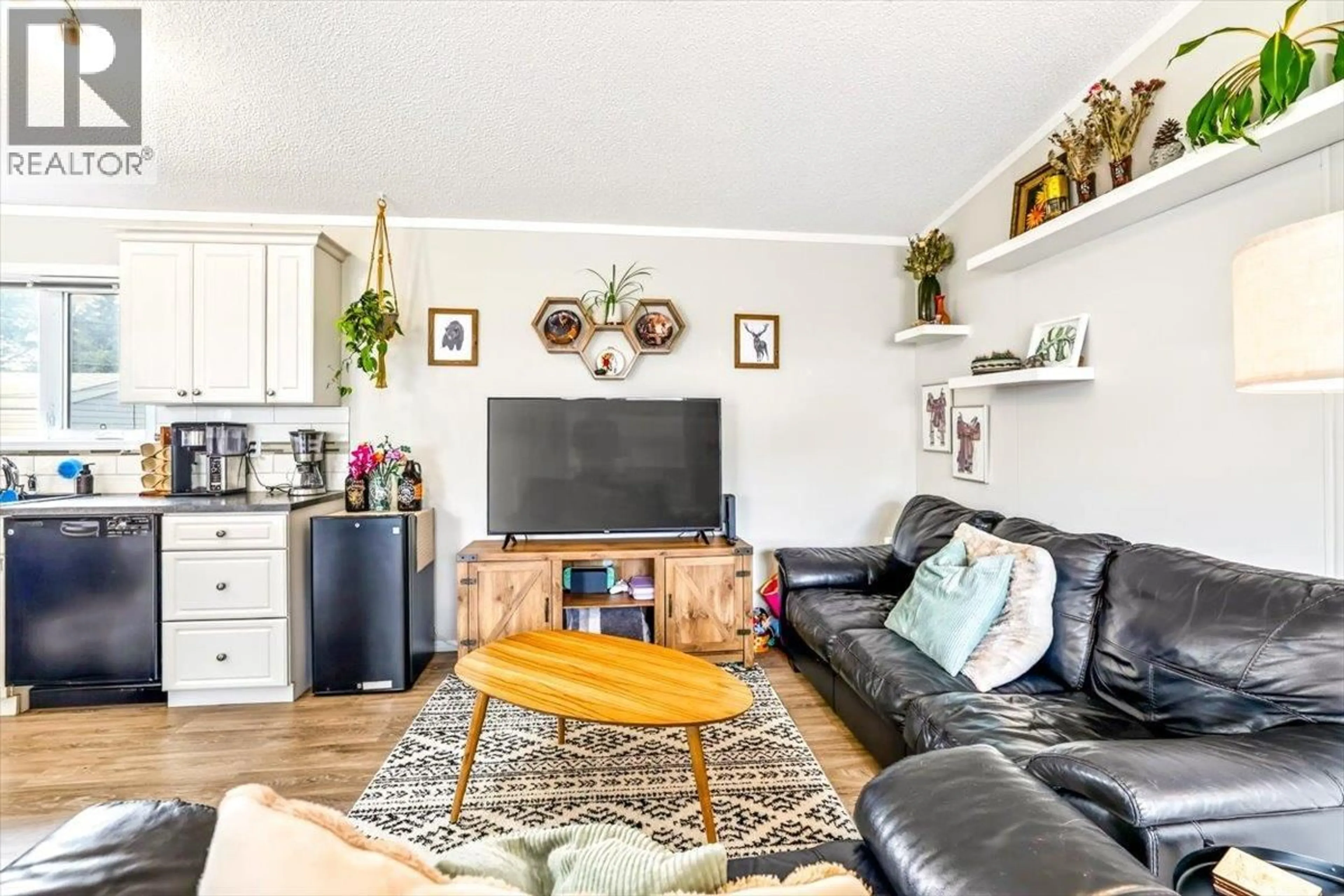 Living room with furniture, wood/laminate floor for C10 - 60 COKATO ROAD, Fernie British Columbia V0B1M4