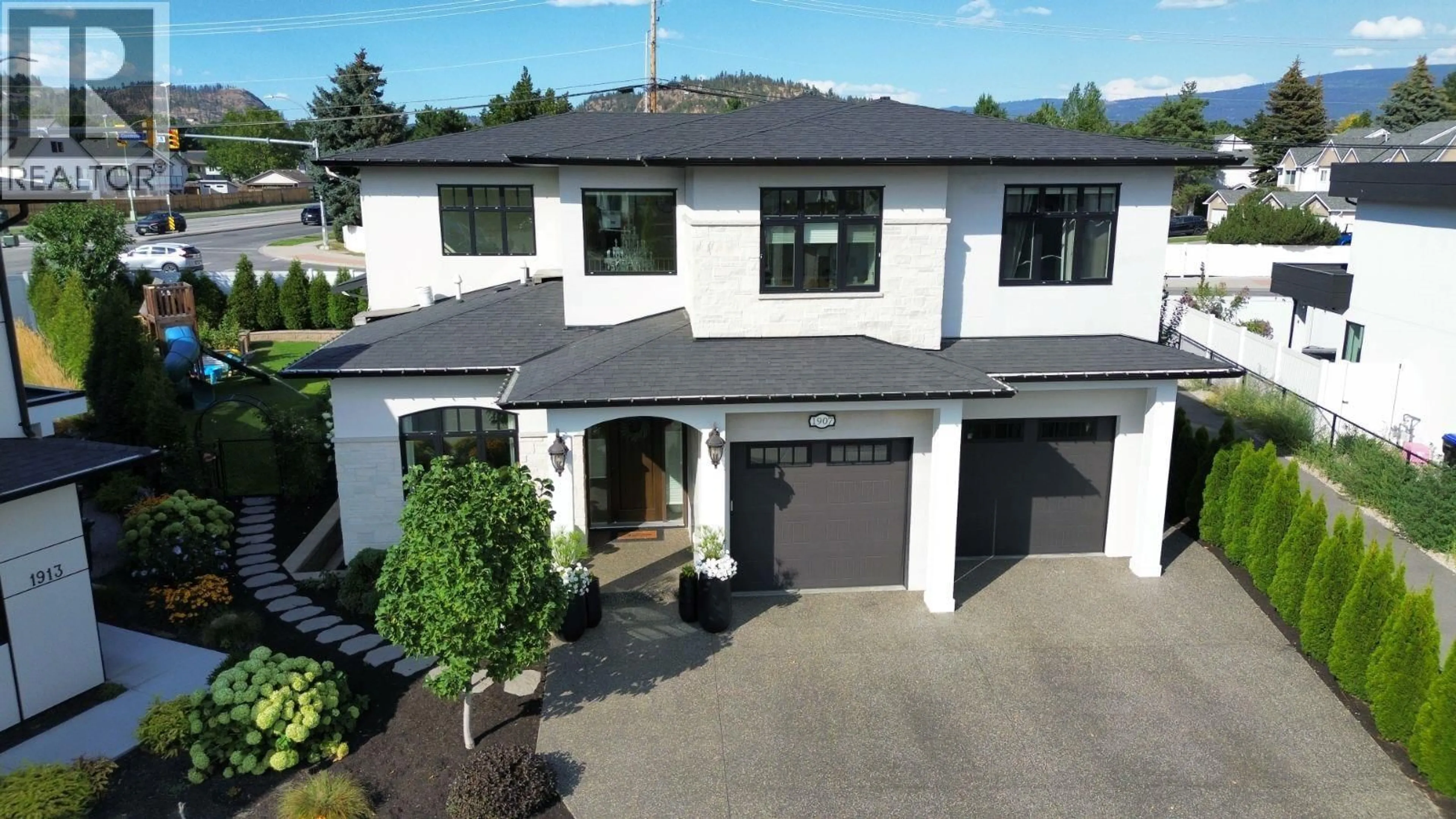 A pic from outside/outdoor area/front of a property/back of a property/a pic from drone, street for 1907 HEMMERLING COURT, Kelowna British Columbia V1V1X1