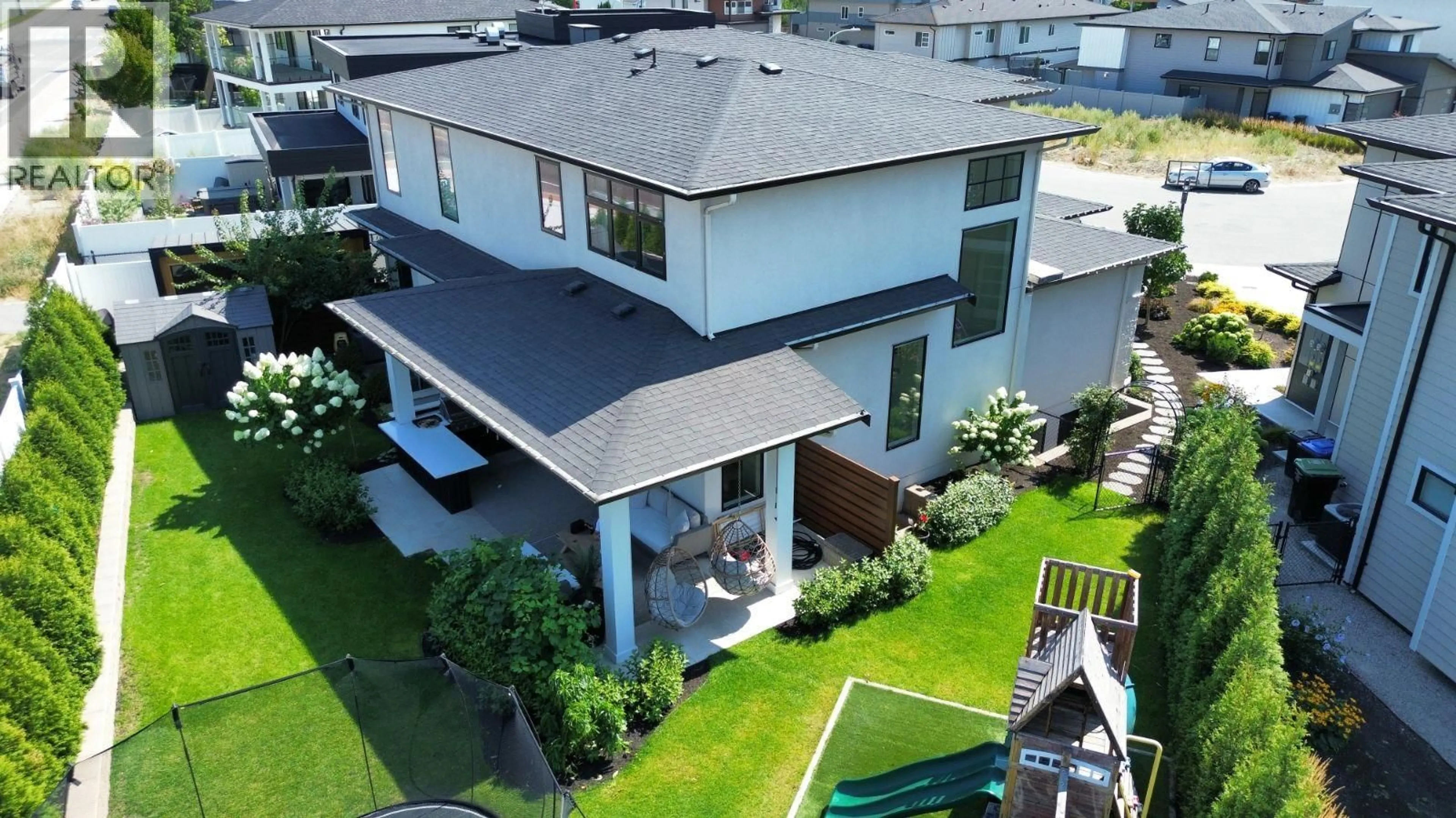 A pic from outside/outdoor area/front of a property/back of a property/a pic from drone, unknown for 1907 HEMMERLING COURT, Kelowna British Columbia V1V1X1