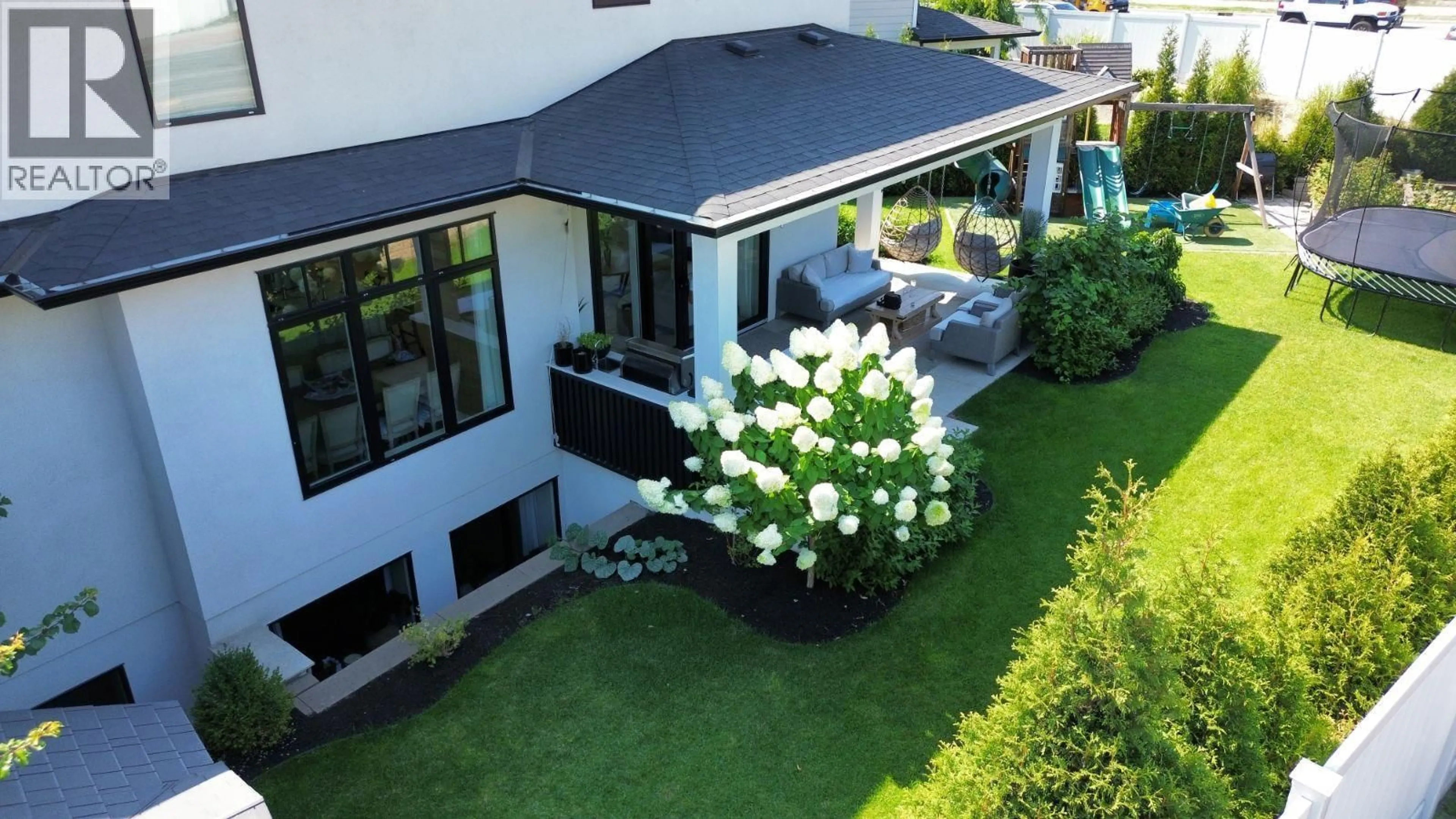 A pic from outside/outdoor area/front of a property/back of a property/a pic from drone, street for 1907 HEMMERLING COURT, Kelowna British Columbia V1V1X1