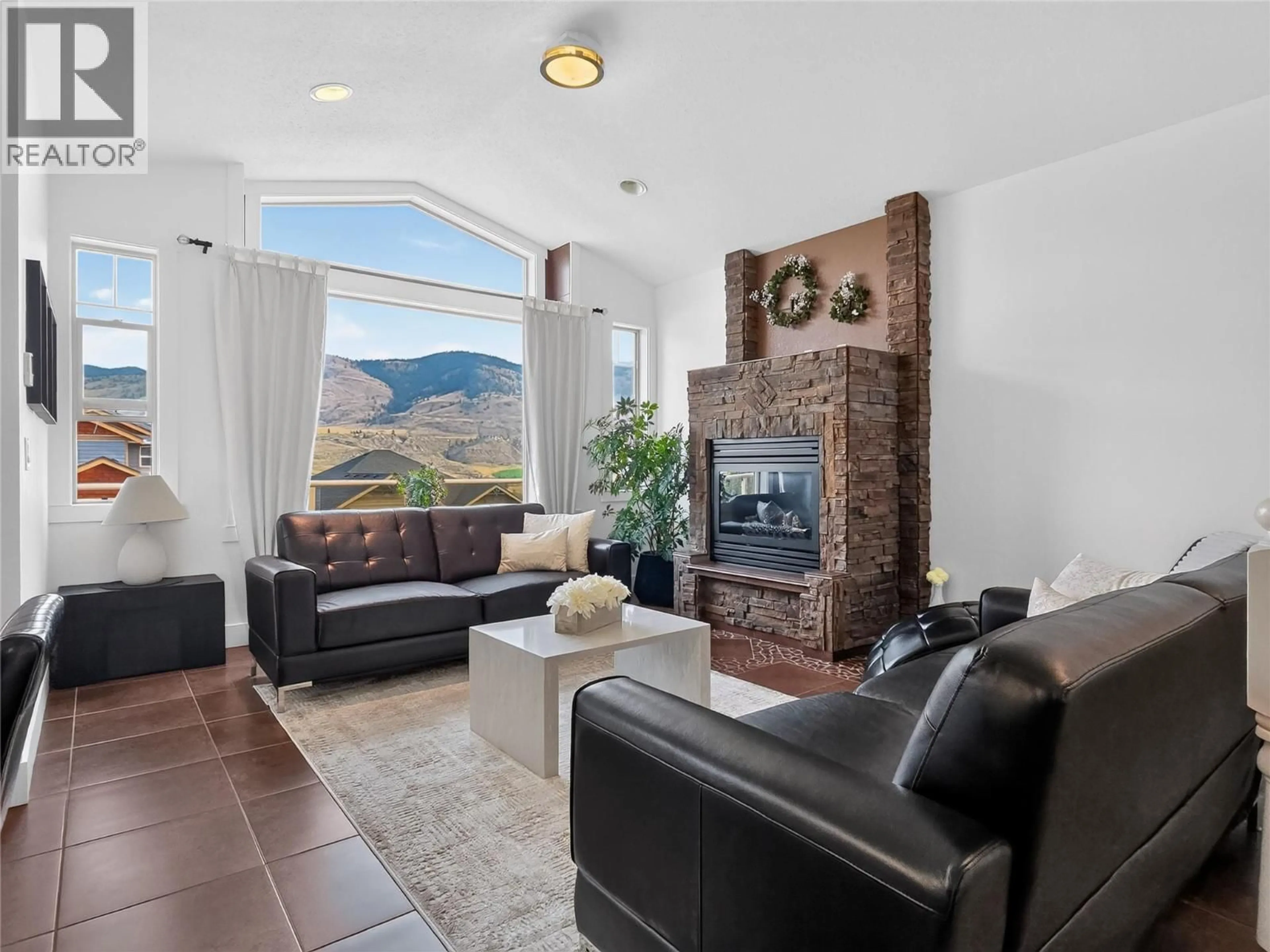 Living room with furniture, ceramic/tile floor for 8723 BADGER DRIVE, Kamloops British Columbia V2C0B2