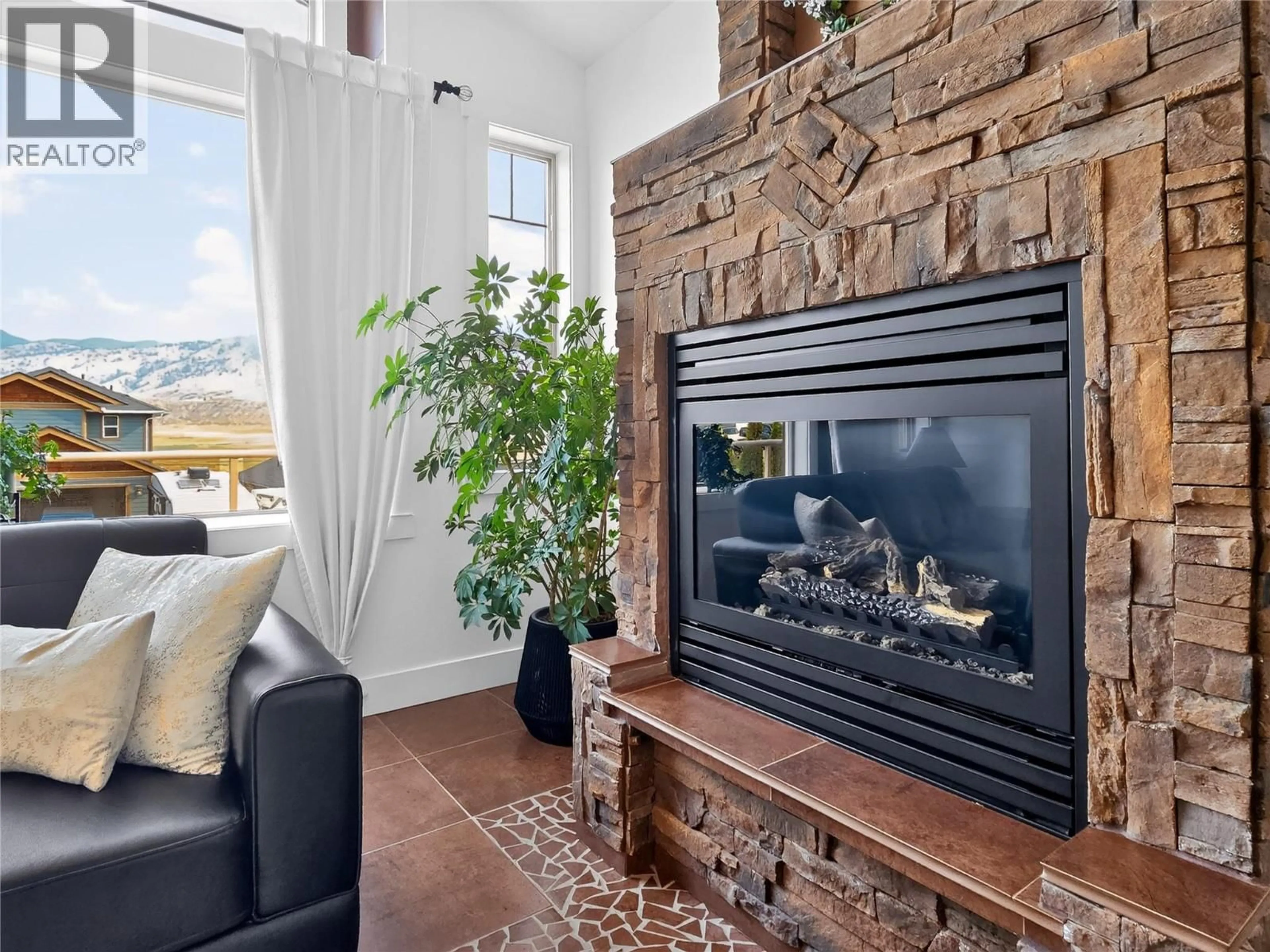 Living room with furniture, ceramic/tile floor for 8723 BADGER DRIVE, Kamloops British Columbia V2C0B2