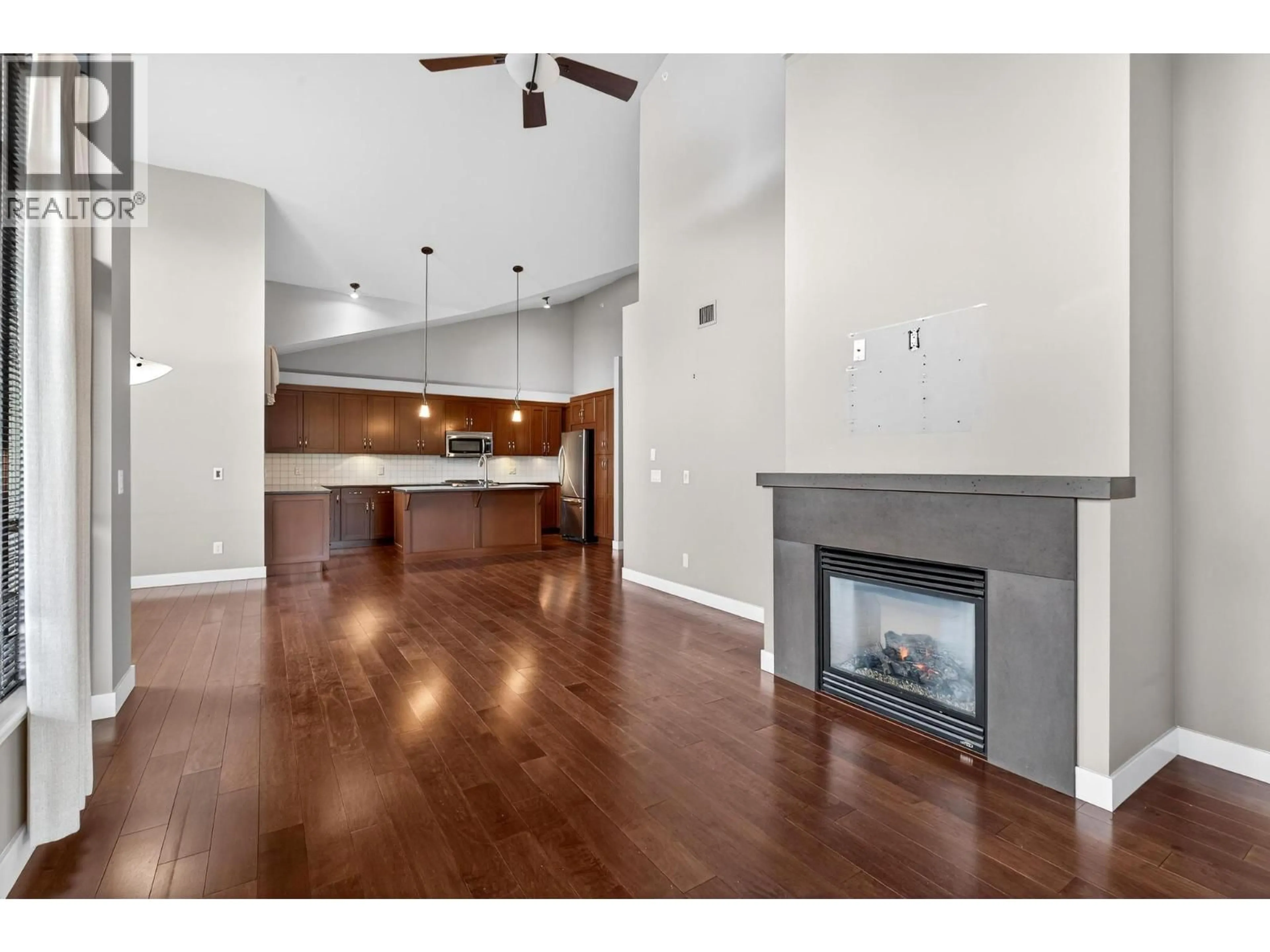 Open concept kitchen, wood/laminate floor for 203 - 600 SARSONS ROAD, Kelowna British Columbia V1W5H5