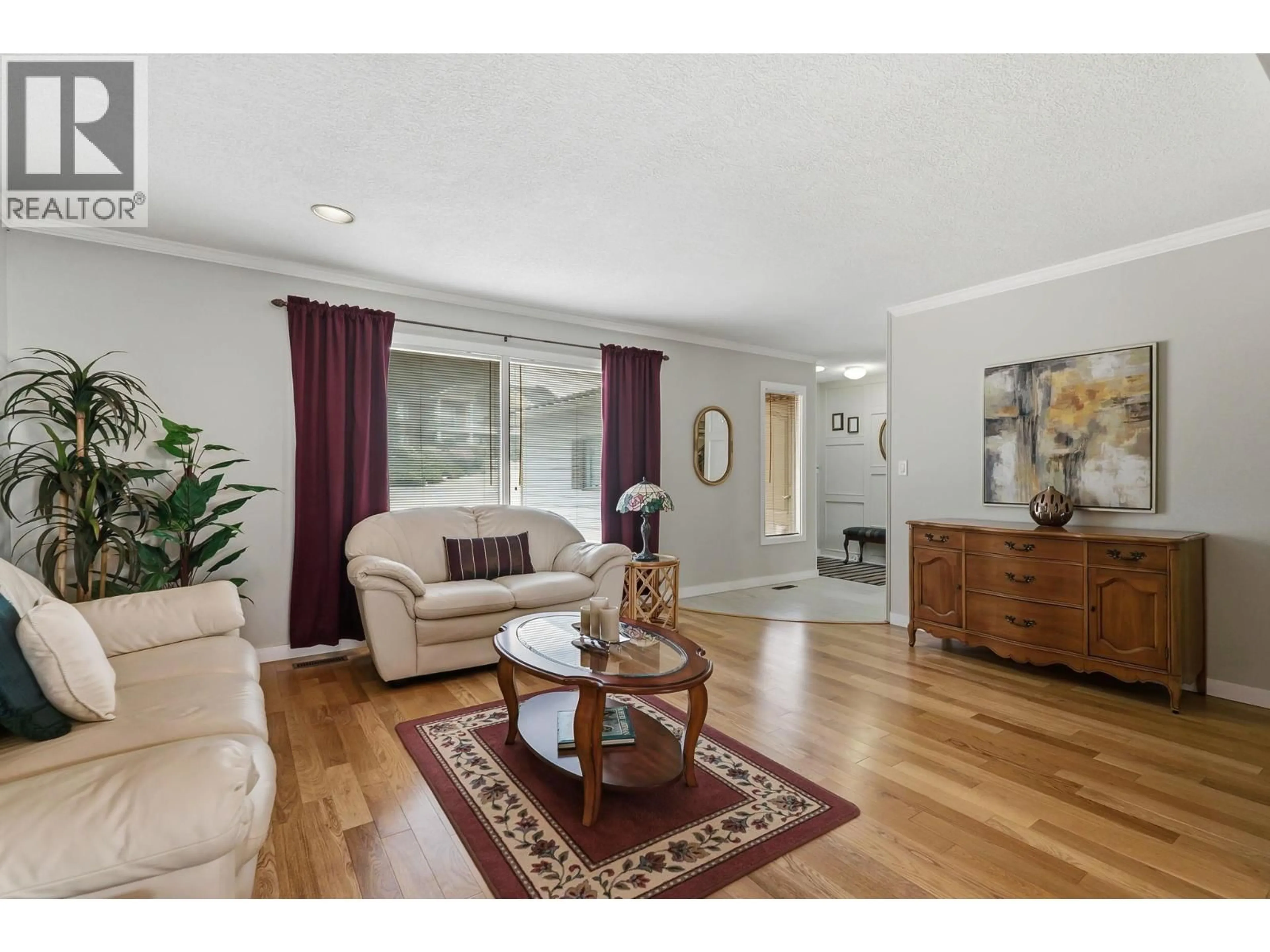 Living room with furniture, wood/laminate floor for 3213 SUNDANCE DRIVE, West Kelowna British Columbia V4T1S4