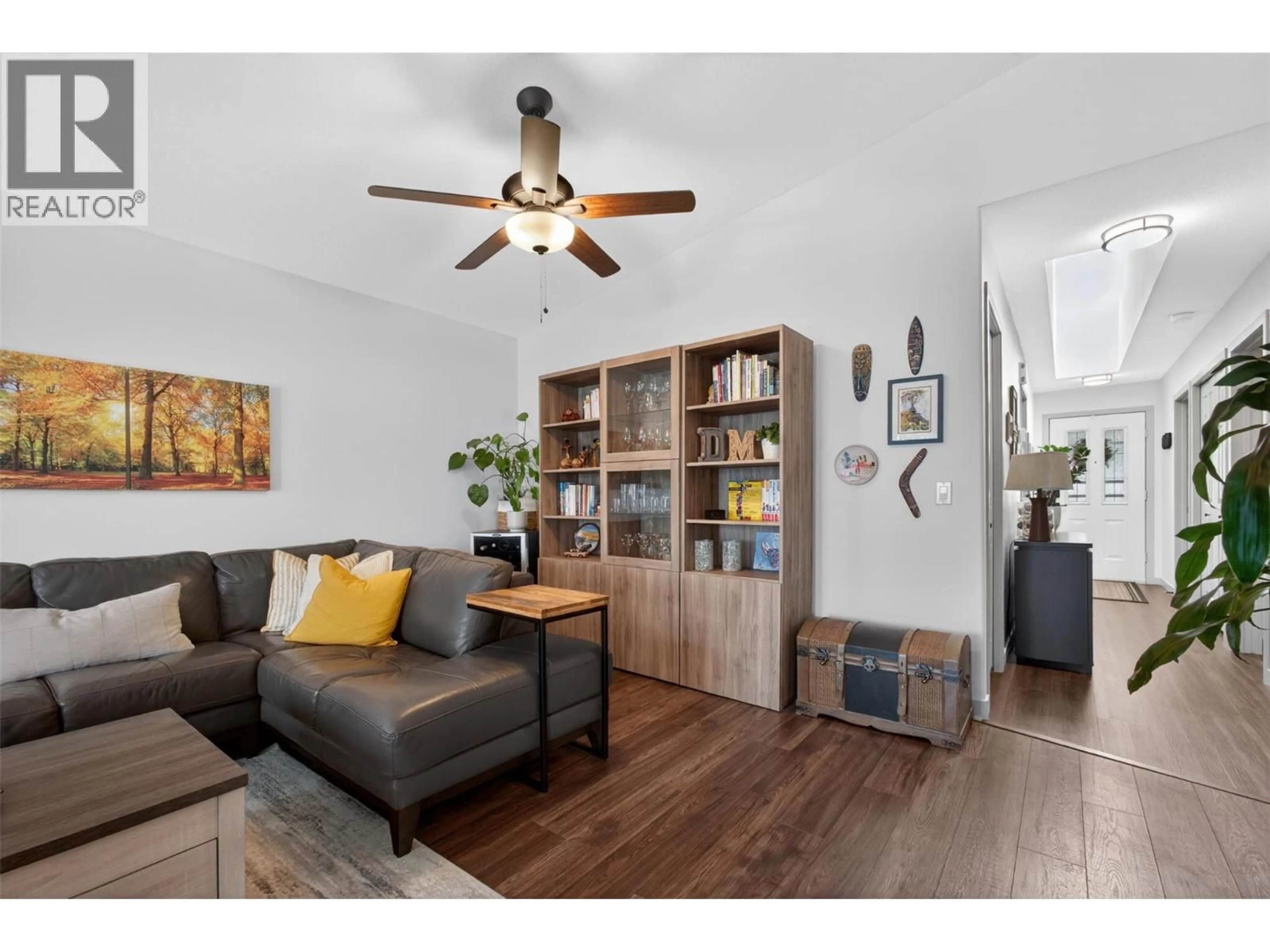 Living room with furniture, wood/laminate floor for 308 - 4630 PONDEROSA DRIVE, Peachland British Columbia V0X1H5