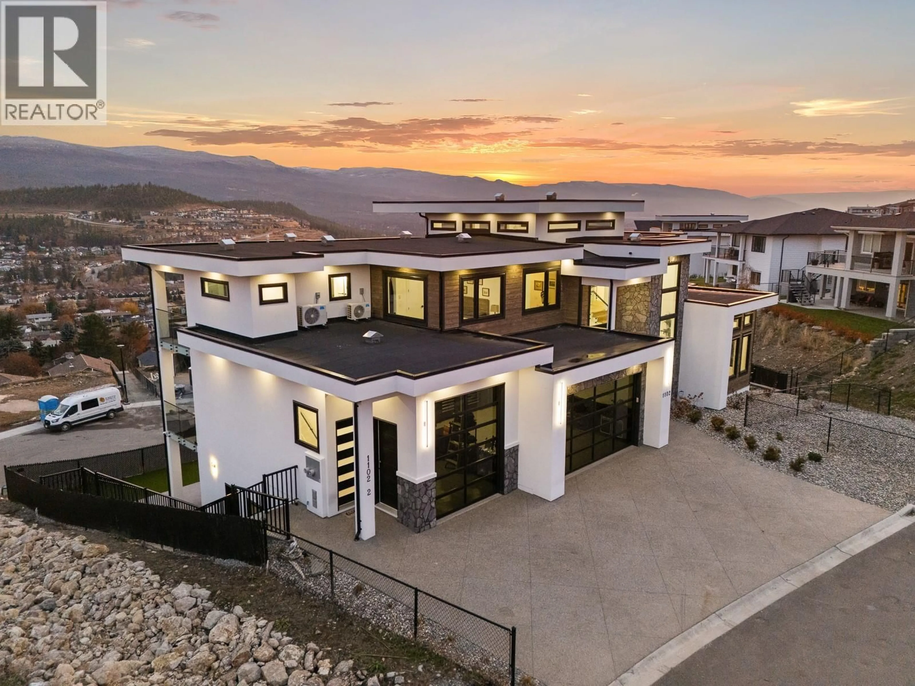A pic from outside/outdoor area/front of a property/back of a property/a pic from drone, mountain view for 1102 CARNOUSTIE DRIVE, Kelowna British Columbia V1P0A3