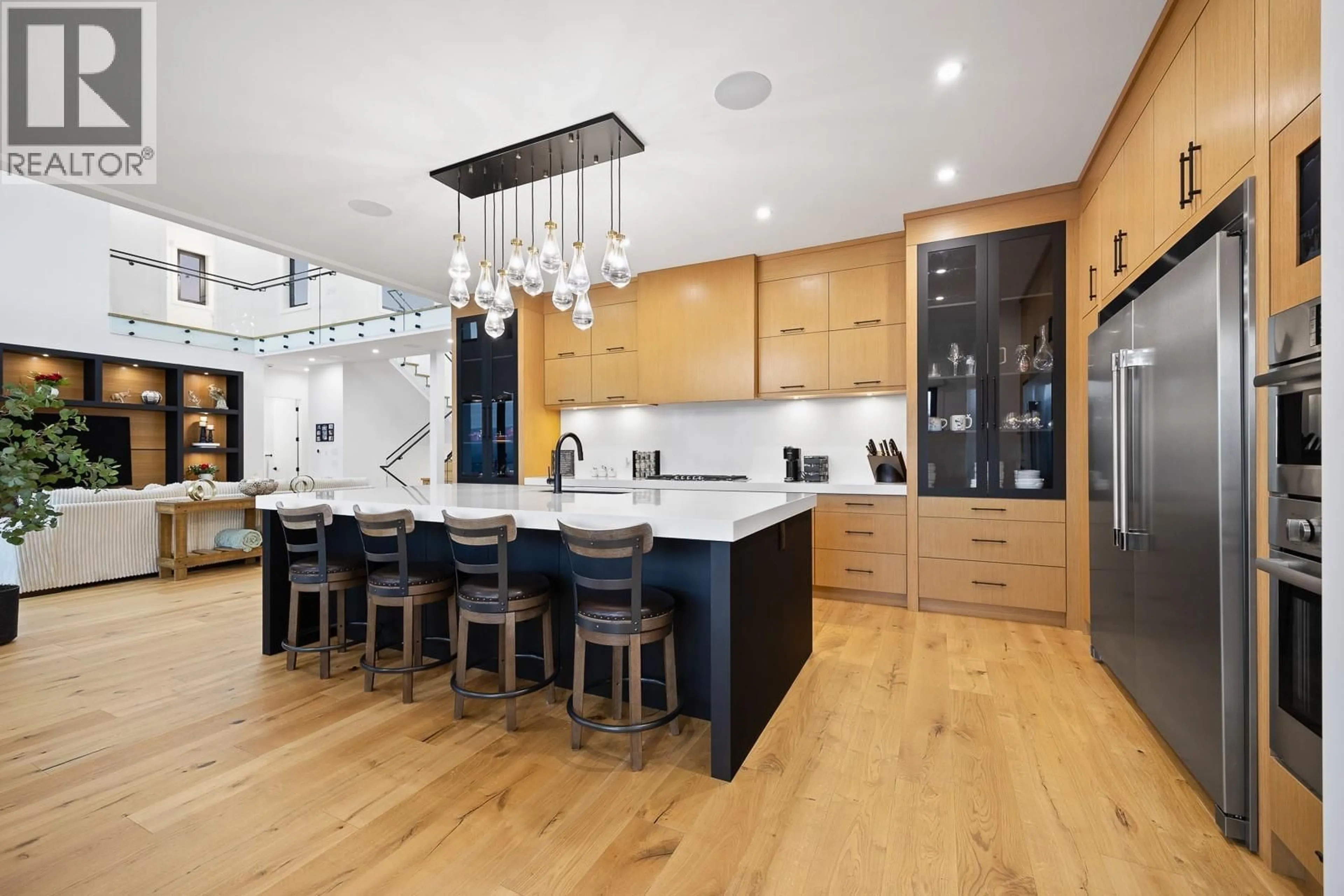 Contemporary kitchen, wood/laminate floor for 1102 CARNOUSTIE DRIVE, Kelowna British Columbia V1P0A3