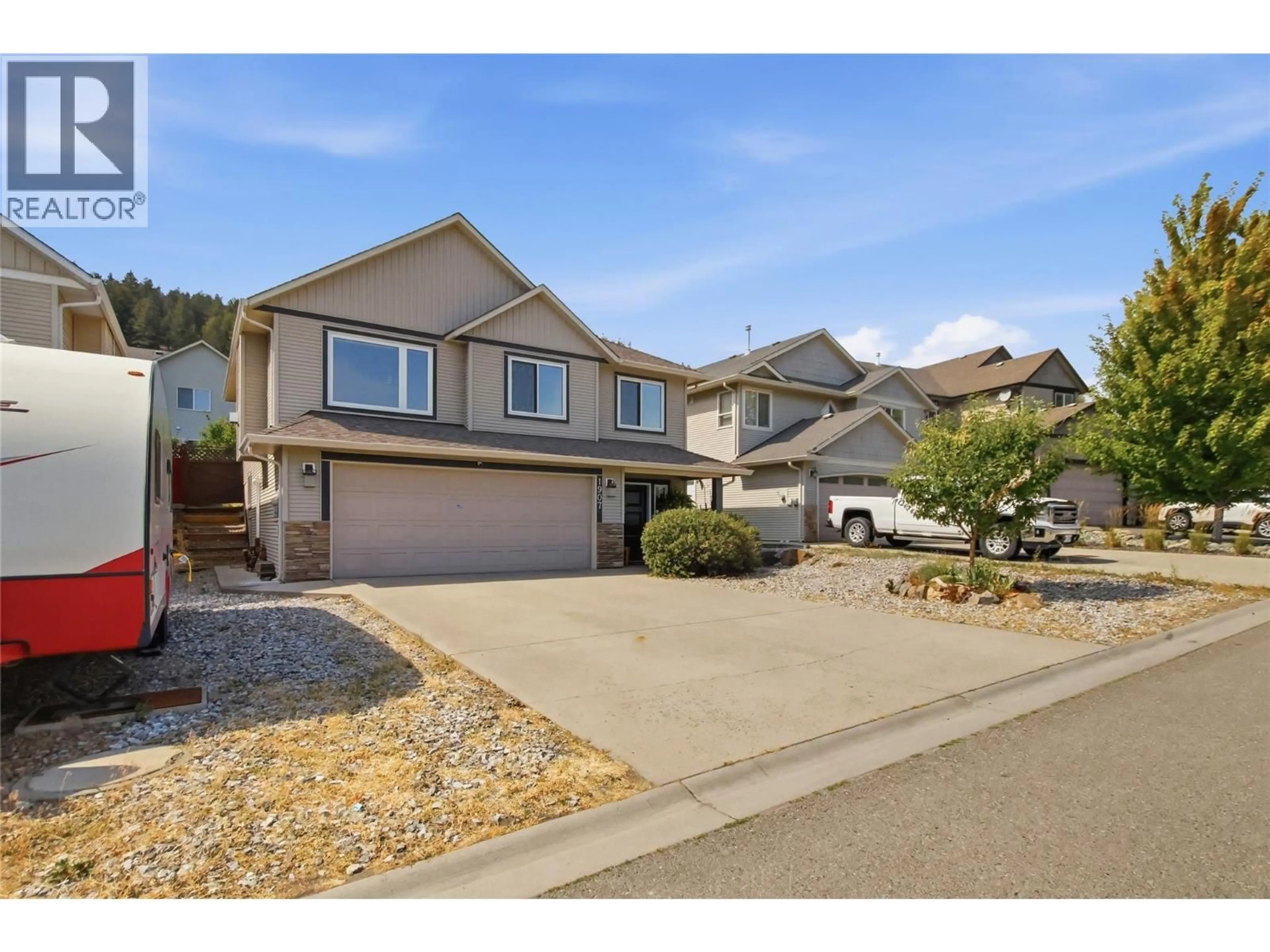 Home with vinyl exterior material, street for 1907 SNOWBERRY CRESCENT, Kamloops British Columbia V1S1Z8