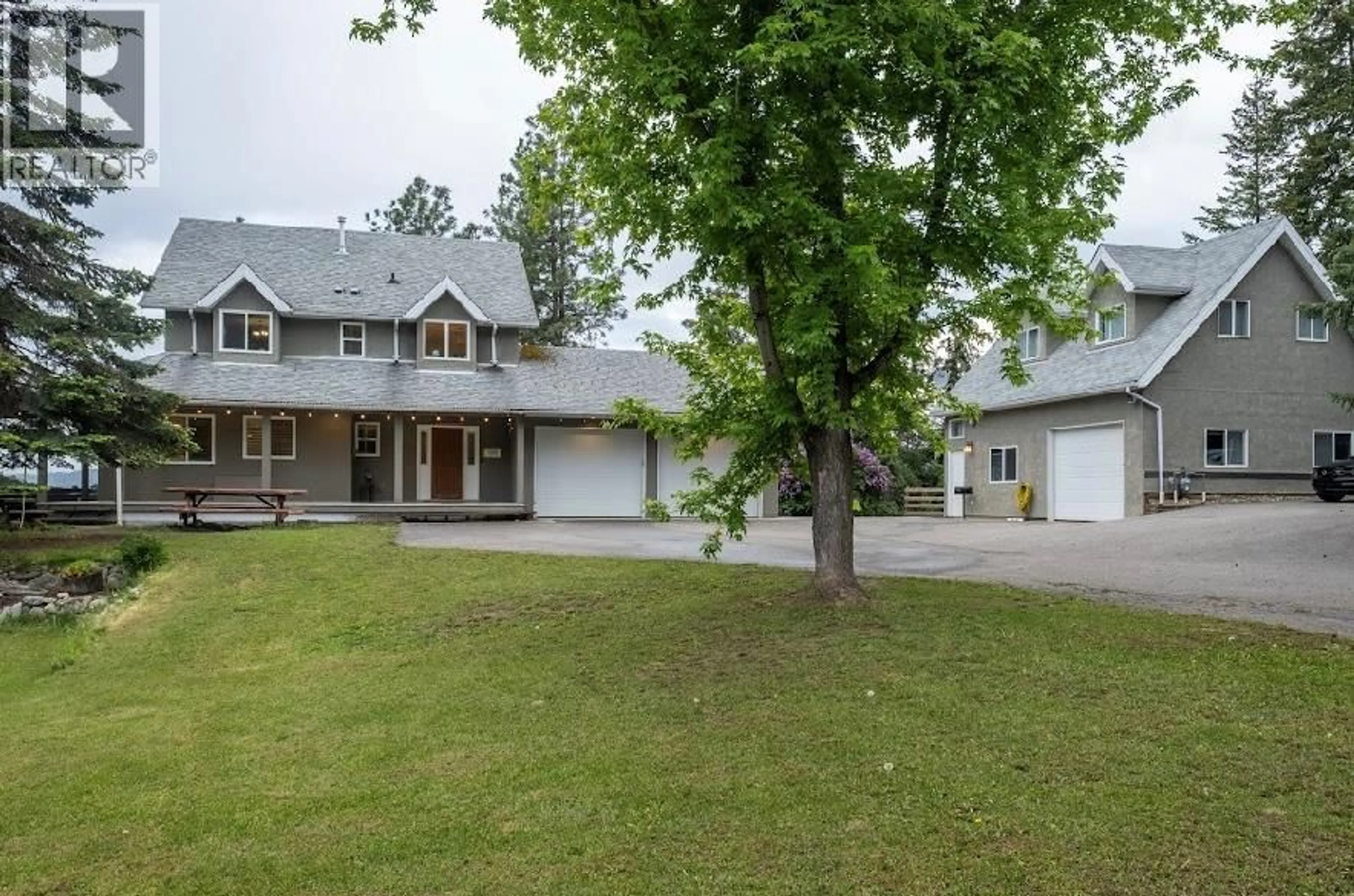 A pic from outside/outdoor area/front of a property/back of a property/a pic from drone, street for 5700 RANCH ROAD, Vernon British Columbia V1B3J9