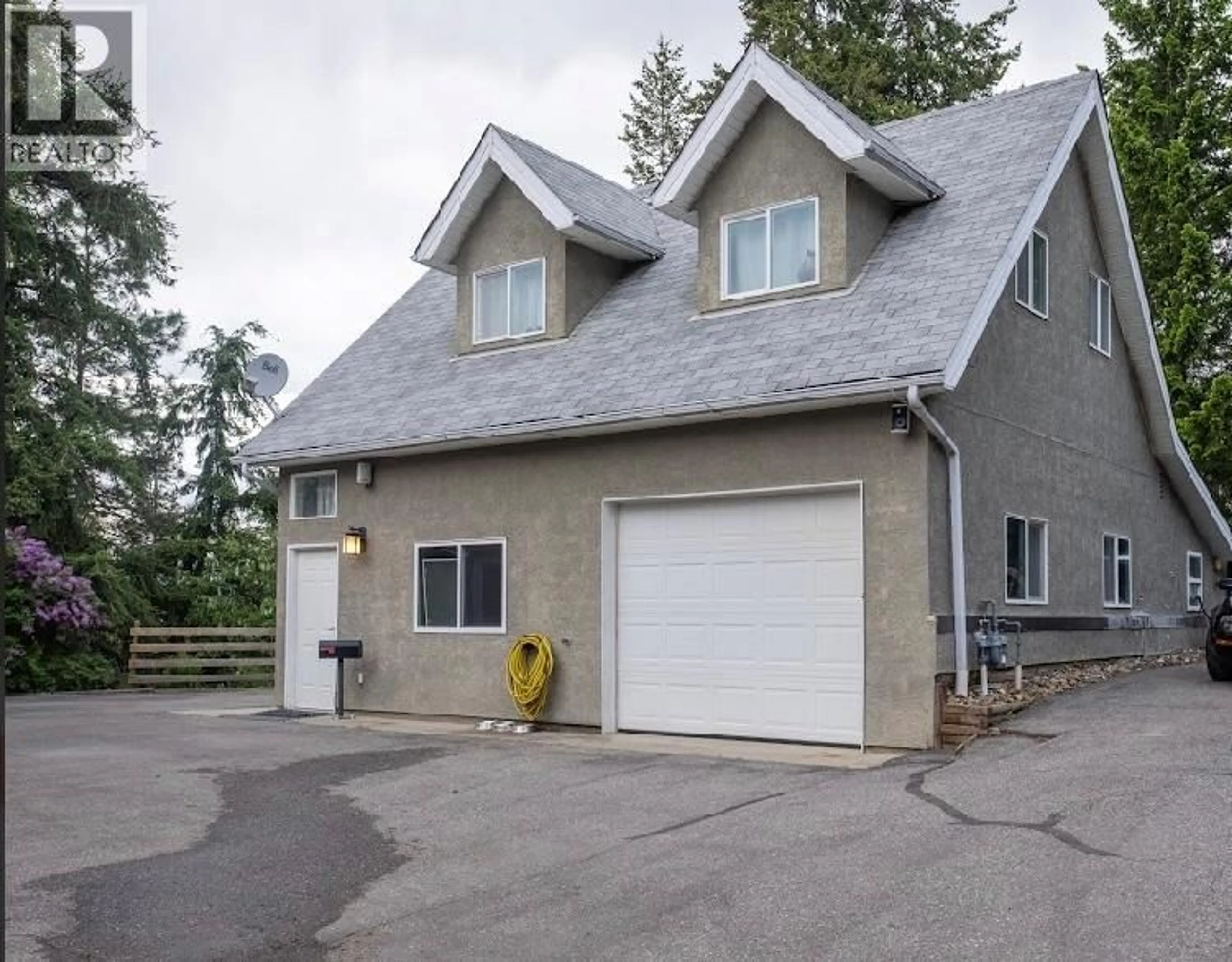 Home with vinyl exterior material, street for 5700 RANCH ROAD, Vernon British Columbia V1B3J9