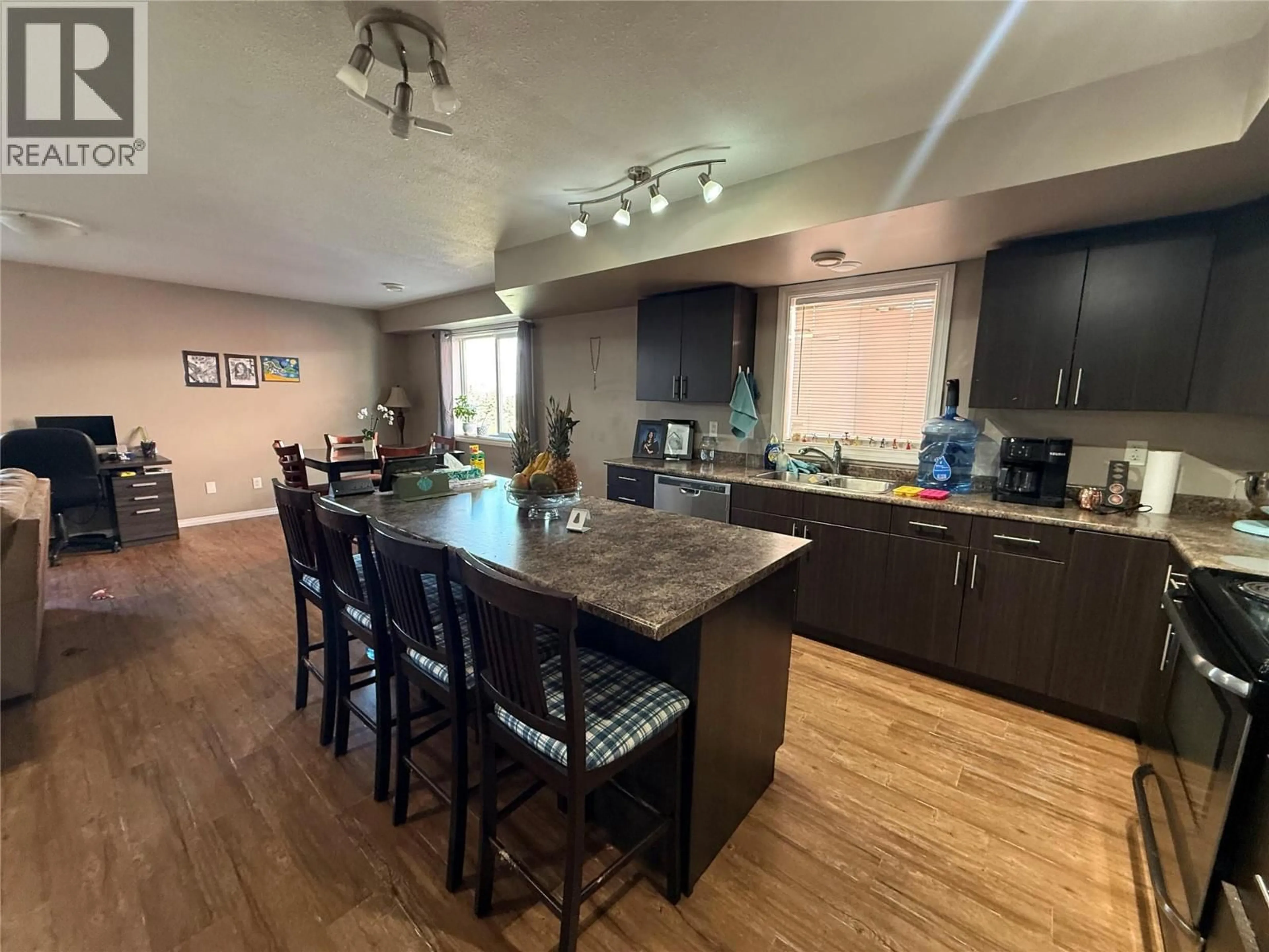 Open concept kitchen, wood/laminate floor for 8107 18 STREET, Dawson Creek British Columbia V1G0G4