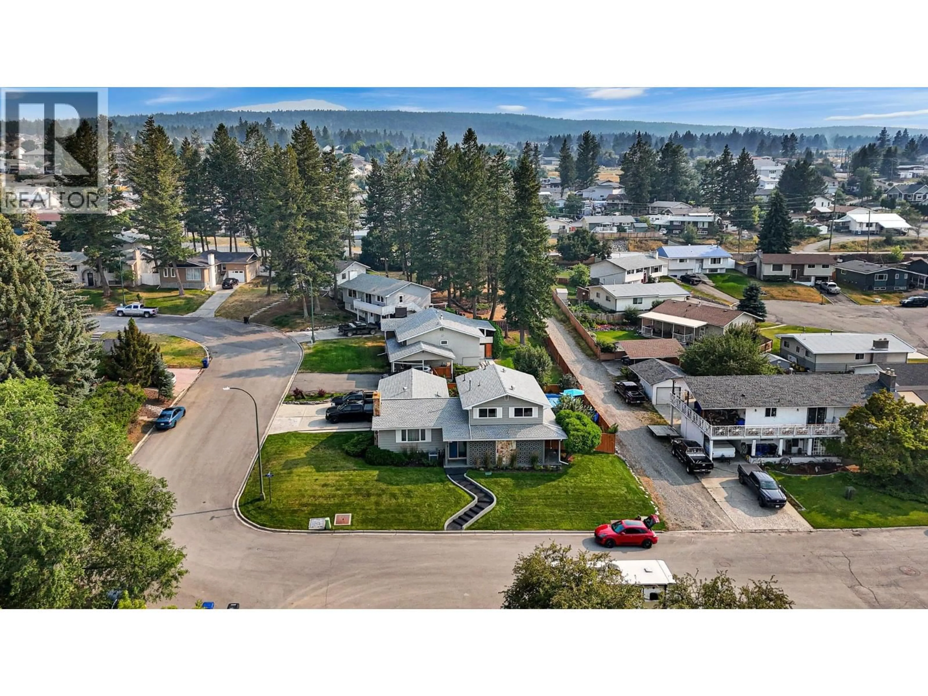 A pic from outside/outdoor area/front of a property/back of a property/a pic from drone, mountain view for 701 17TH AVENUE SOUTH, Cranbrook British Columbia V1C3B6