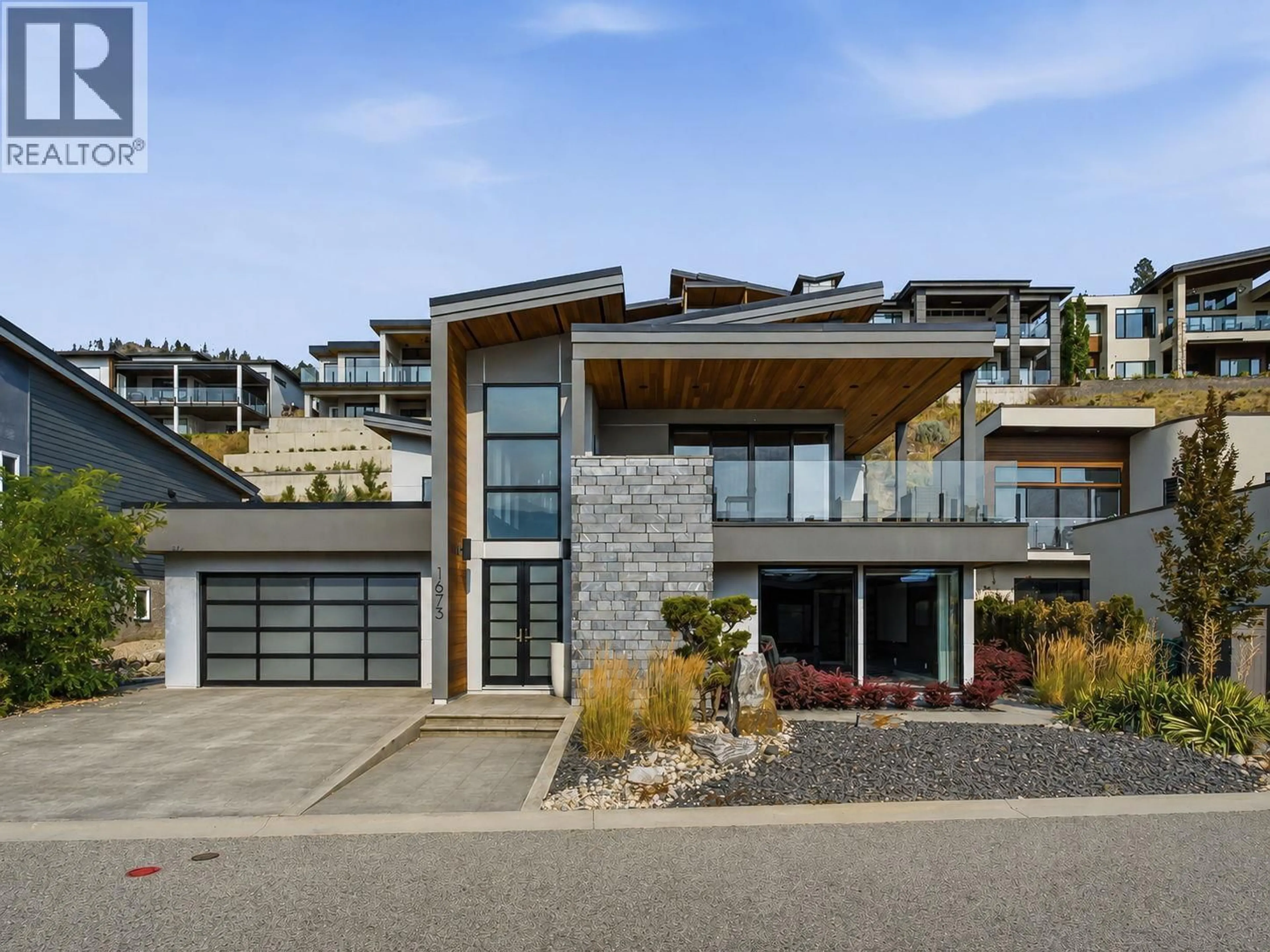 Home with brick exterior material, street for 1673 TRAVERTINE DRIVE, Lake Country British Columbia V4V2T4