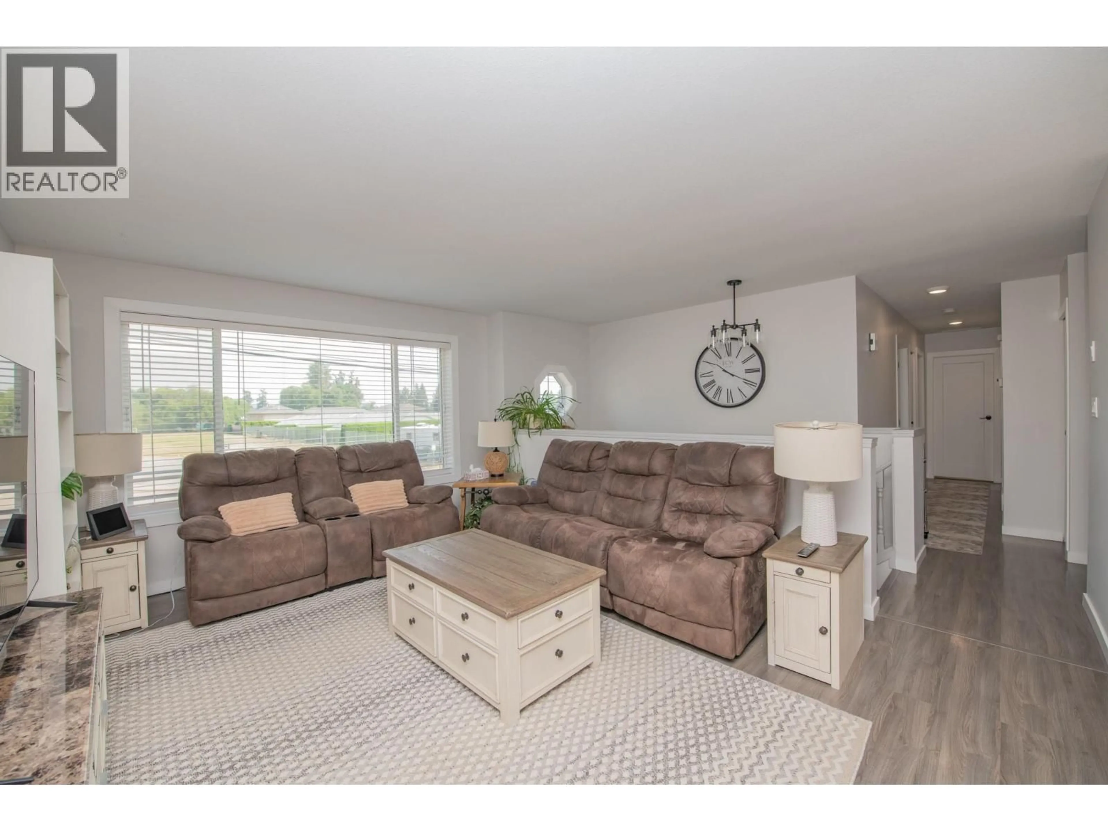 Living room with furniture, wood/laminate floor for 3645 PATTEN DRIVE, Armstrong British Columbia V4Y0H9
