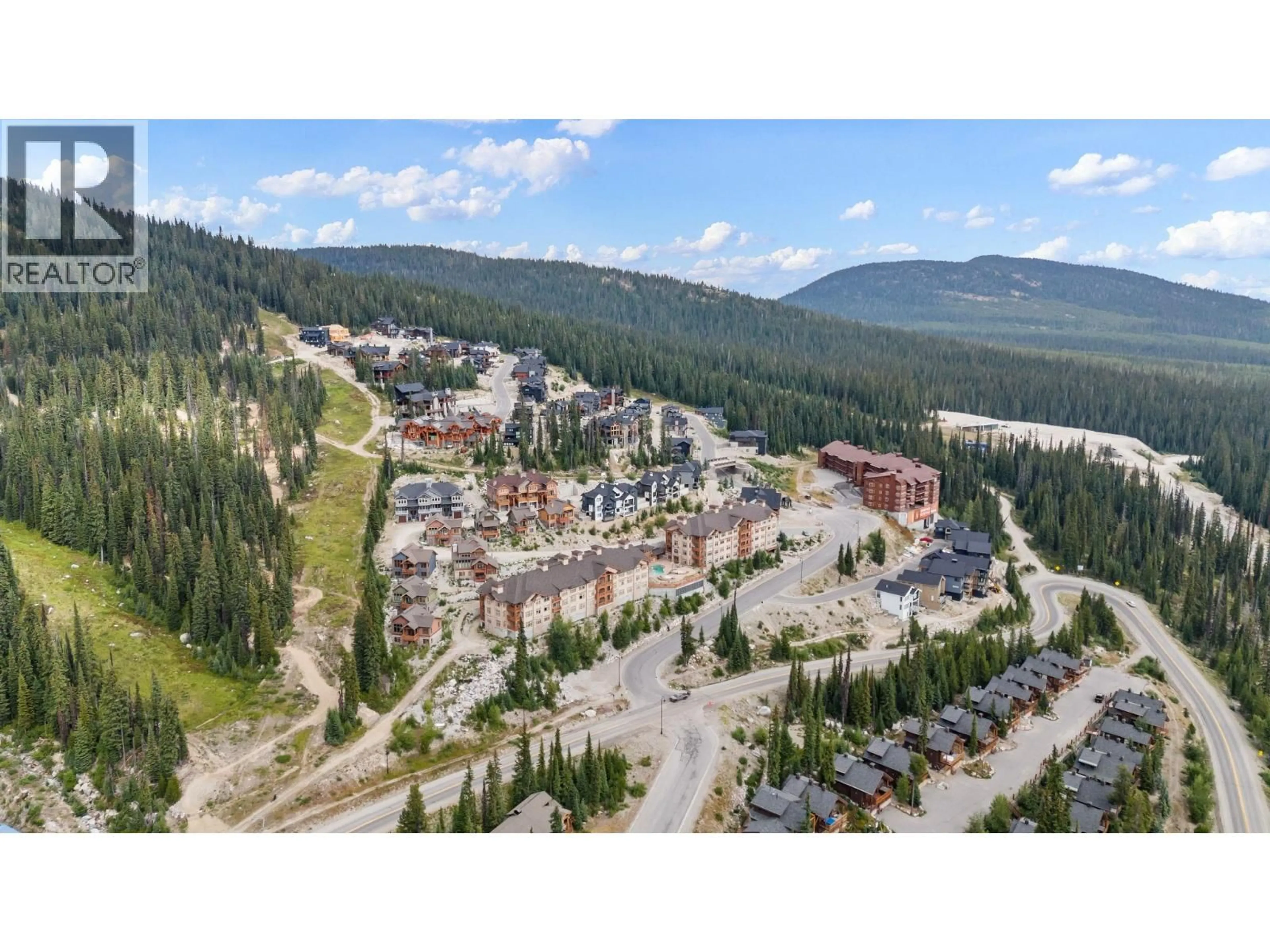 A pic from outside/outdoor area/front of a property/back of a property/a pic from drone, mountain view for 207 - 255 FEATHERTOP WAY, Big White British Columbia V1P1T4