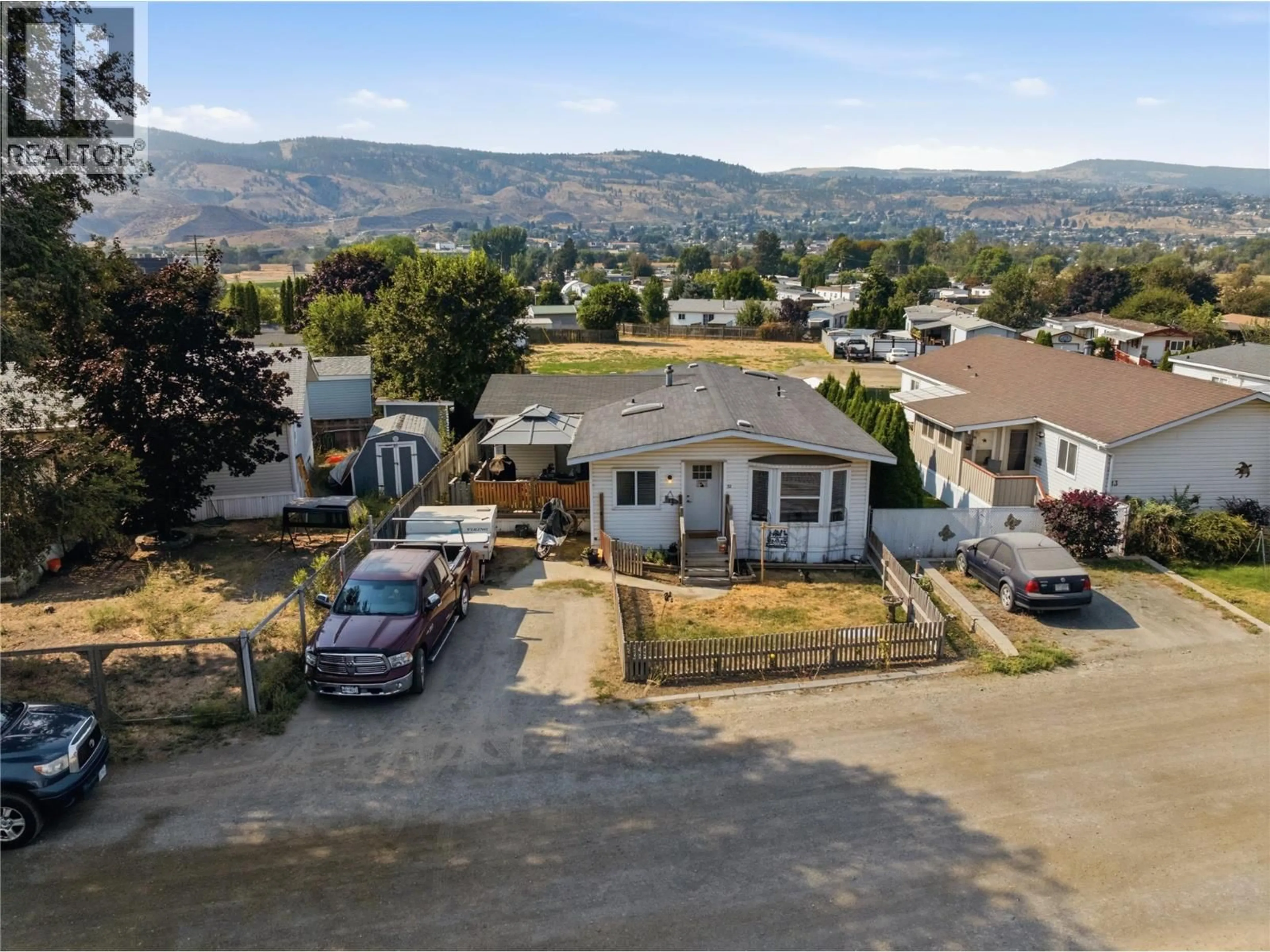 A pic from outside/outdoor area/front of a property/back of a property/a pic from drone, mountain view for 12 - 240 G & M ROAD, Kamloops British Columbia V2H1A4