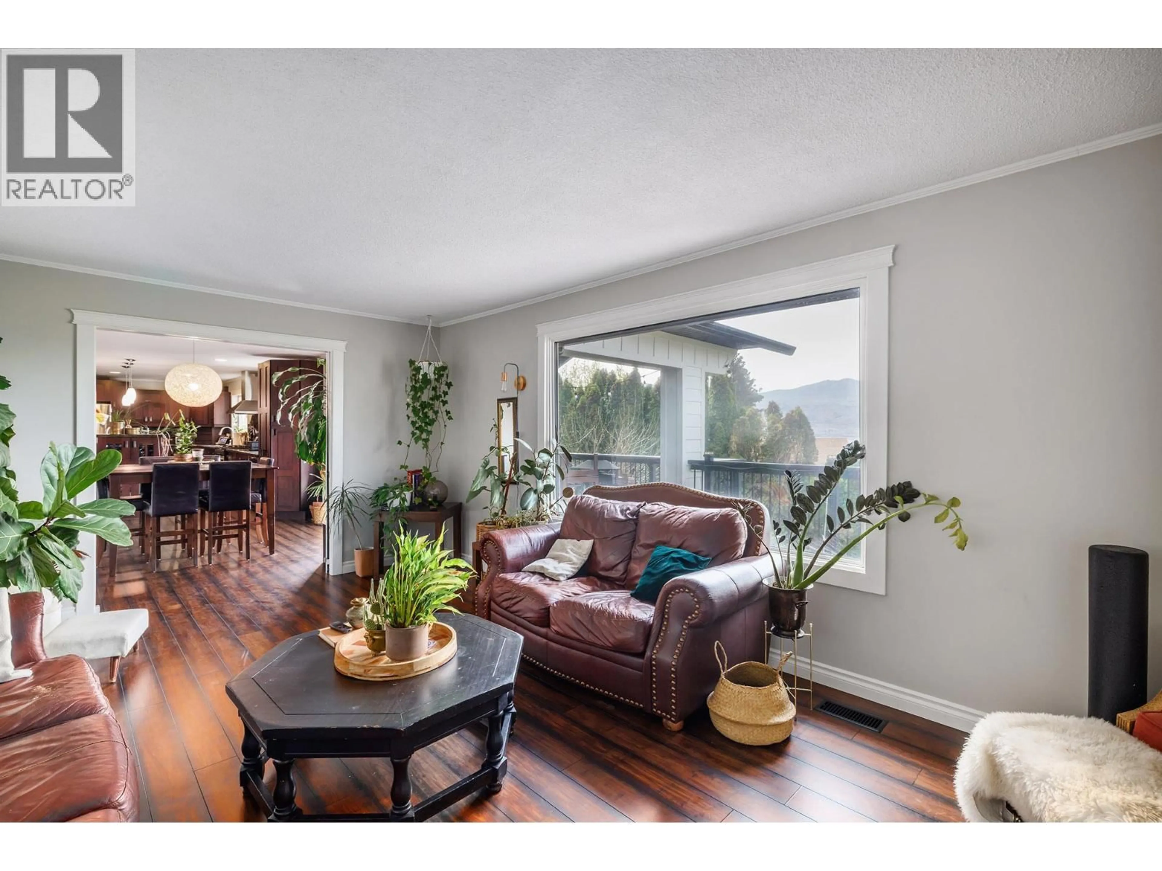 Living room with furniture, wood/laminate floor for 1185 SUNNYSIDE ROAD, West Kelowna British Columbia V1Z2S5